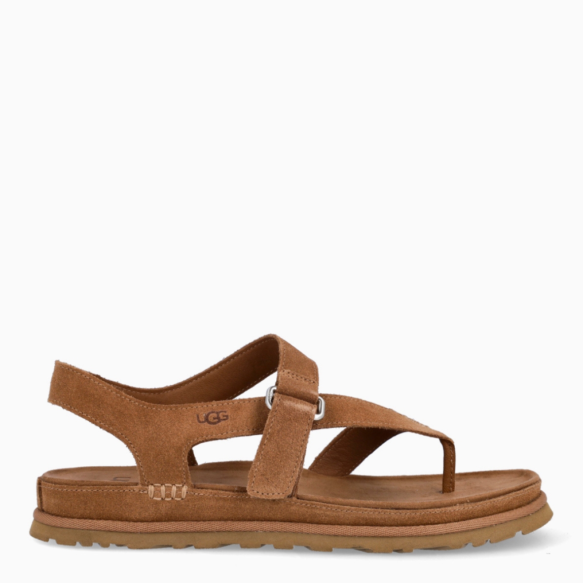 Sandalias esclava de la marca UGG, modelo GOLDENSTAR. Sandalias elaboradas en ante color cuero. Forro textil de fibras de poliéster 100 % reciclado, forro de microfibra. El tejido de la plantilla está fabricado con fibras de poliéster 100 % reciclado, la plantilla cuenta con un tratamiento antiolores a base de menta. Cierre de estas sandalias con tiras cruzadas y velcro en pala. . Entresuela de EVA de caña de azúcar reciclada. Suela de goma EVA de caña de azúcar. Sandalias esclava UGG GOLDENSTAR es un complemento básico e ideal en comodidad!