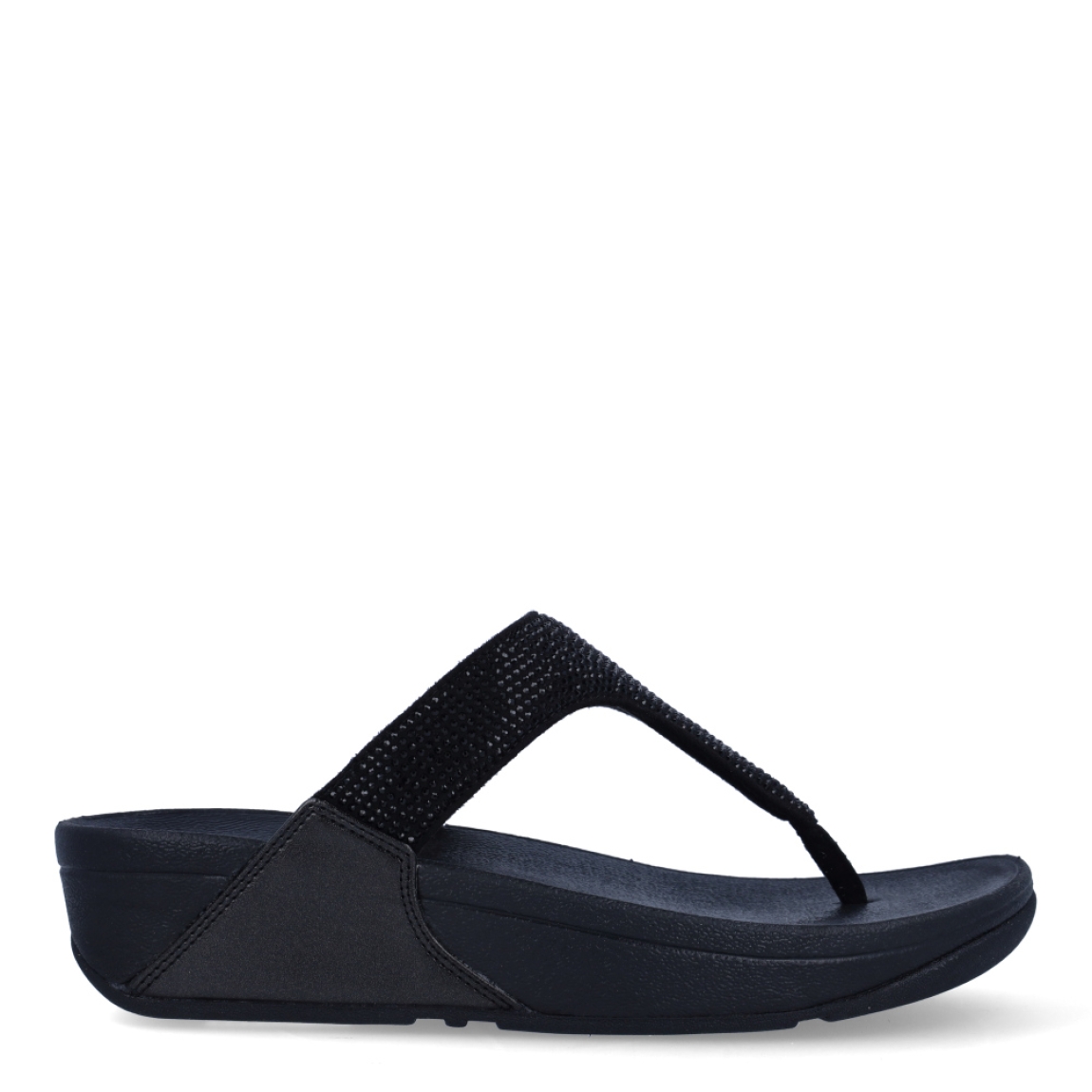 Sandalias de la marca Fitflop, modelo Lulu Crystal. Exterior en ante color negro, decorado con brillantes. Interior en microfibra de color taupe. Suela de caucho antideslizante y planta acolchada. Cuña de 4 cm incluyendo 2,5 cm de plataforma. Con detalle de piel sintética perlada metalizada en los laterales. Fabulosas de día y de noche.