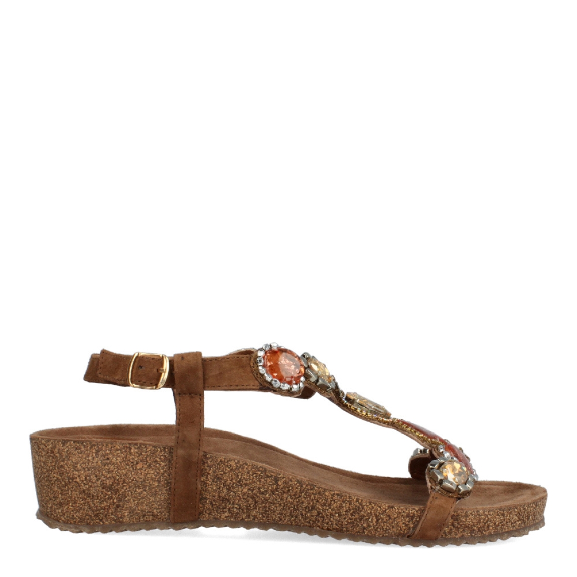 Sandalias de la marca Itse, modelo MOCHICA. Exterior de las sandalias en ante color marrón con detalles en pedrería. Interior de las sandalias en ante colro marrón. Cierre de las sandalias con hebilla y cuña de 3cm de altura. Estas sandalias Itse MOCHICA son un complemento ideal para crear looks con estilo y comodidad, tanto de día como de noche.