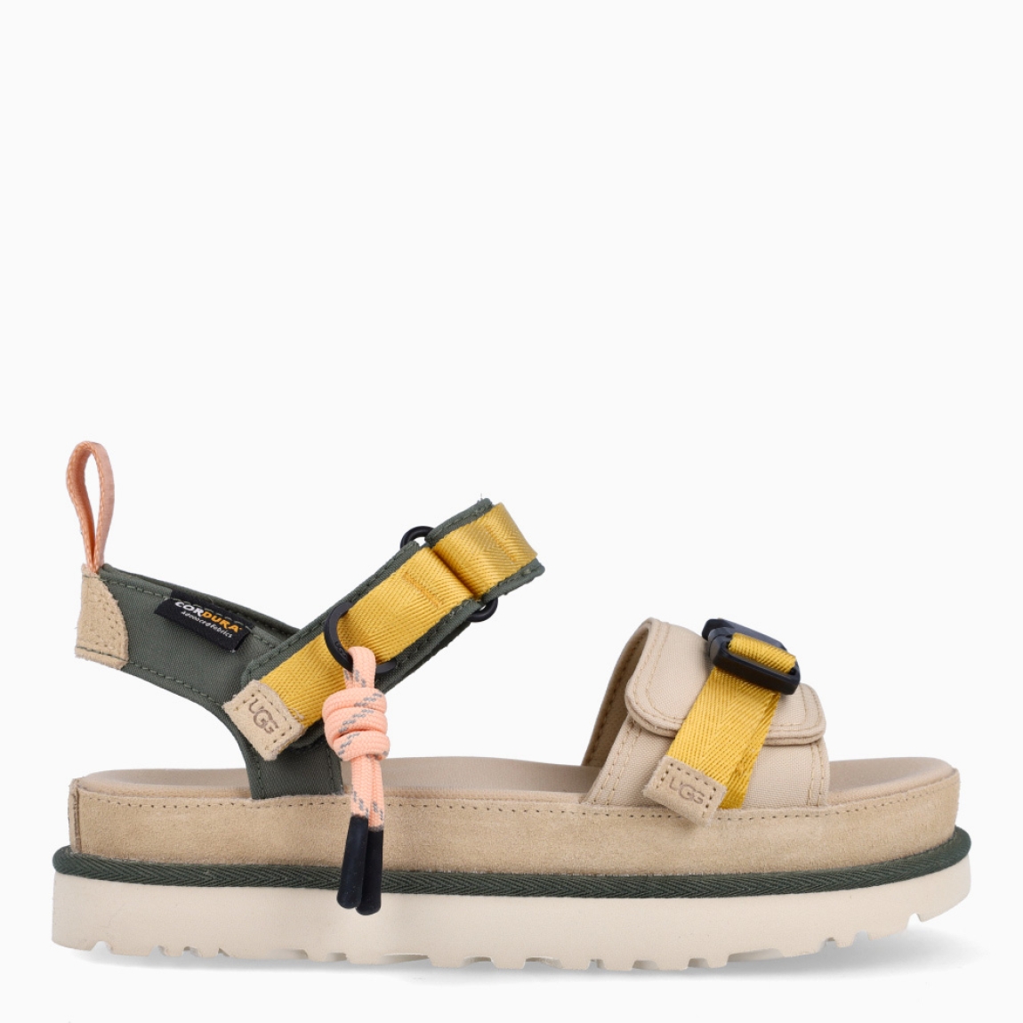 Sandalias de la marca UGG, modelo MULTI. Elaboradas en naylon multicolor. Sandalias con forro textil hecho de fibras de poliéster 100 % reciclado. Cierre de sandalias UGG con doble velcro en pala. El tejido de la plantilla está fabricado con fibras de poliéster 100 % reciclado, la plantilla cuenta con un tratamiento antiolores a base de menta. Suela de goma EVA de caña de azúcar. Estas sandalias UGG MULTI son un complemento ideal para gozar de comodidad absoluta!