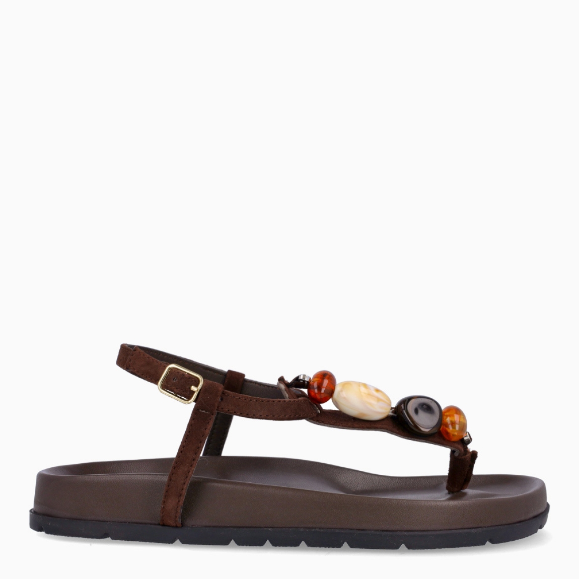 Sandalias de la marca Itse, modelo SAMOS. Sandalias elaboradas en piel color marrón oscuro. Sandalias esclavas con tiras cruzadas en pala y piedras en colores tierra. Cierre de sandalias Itse con hebilla. Suela plana y muy cómoda. Sandalias Itse SAMOS, complemento ideal para llevarlo en tu día día, con frescura y modernidad.