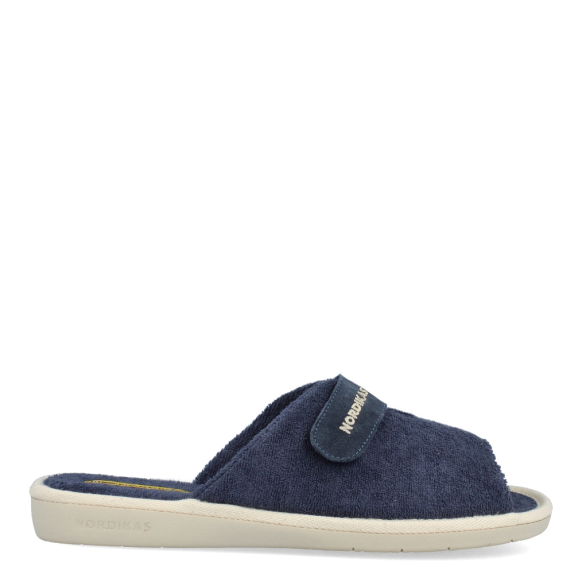 Zapatillas de la marca Nordikas, modelo TOP LINE. Exterior e interior de las zapatillas en toalla color azul. Cierre de las zapatillas con velcro y suela de goma plana. Estas zapatillas Nordikas TOP LINE, te hará disfrutar de la comodidad y ligereza de estar por casa.