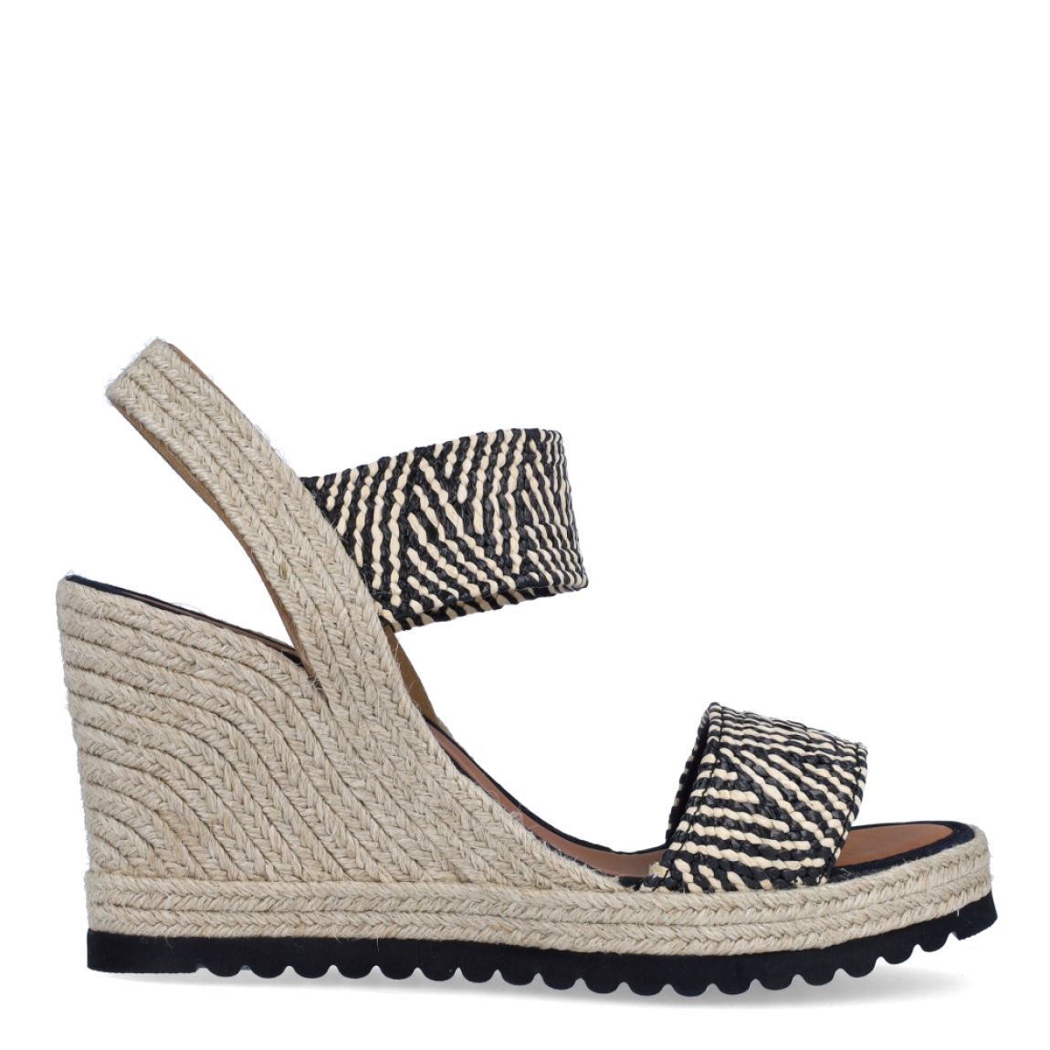 Alpargatas de la marca Casteller, modelo BLUMA. Exterior de las alpargatas en textil con efecto corrugado multicolor entre blanco y negro con diseño. Interior de las alpargatas en piel color camel. Alpargatas con cuña de 8cm de altura. Estas alpargatas Casteller BLUMA son una tendencia de temporada. Gracias a su diseño, podrás estilizar tus looks con la máxima comodidad posible.