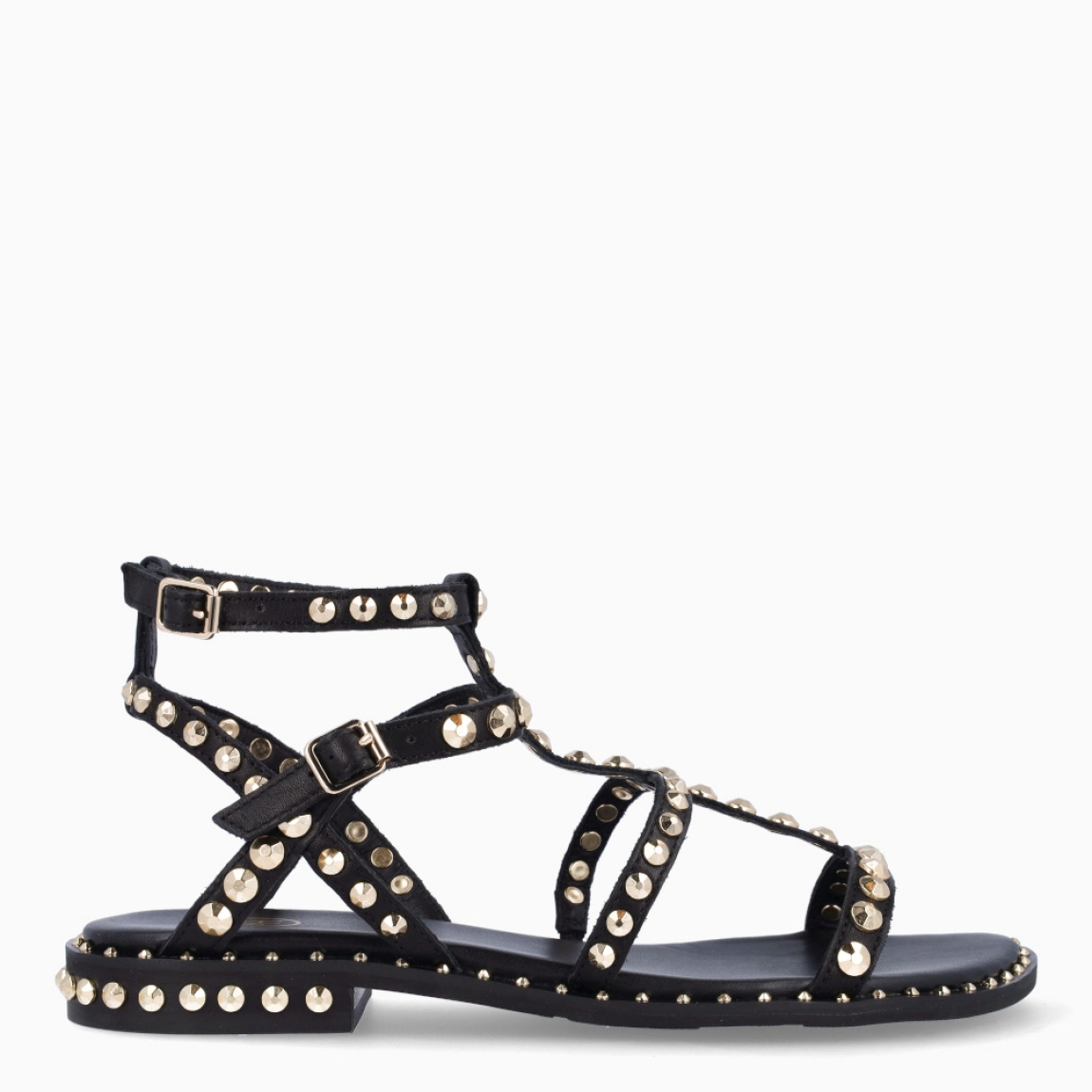 Sandalias de la marca ASH, modelo PRECIOUS. Elaboradas en piel color negro con detalle de tachuelas doradas y tiras hasta arriba. Interior en piel color negro. Cierre de sandalias ASH con doble hebilla en tobillo. Suela plana de goma. Estas sandalias ASH PRECIOUS son ideales para llevar tus looks de temporada con estilo y comodidad!