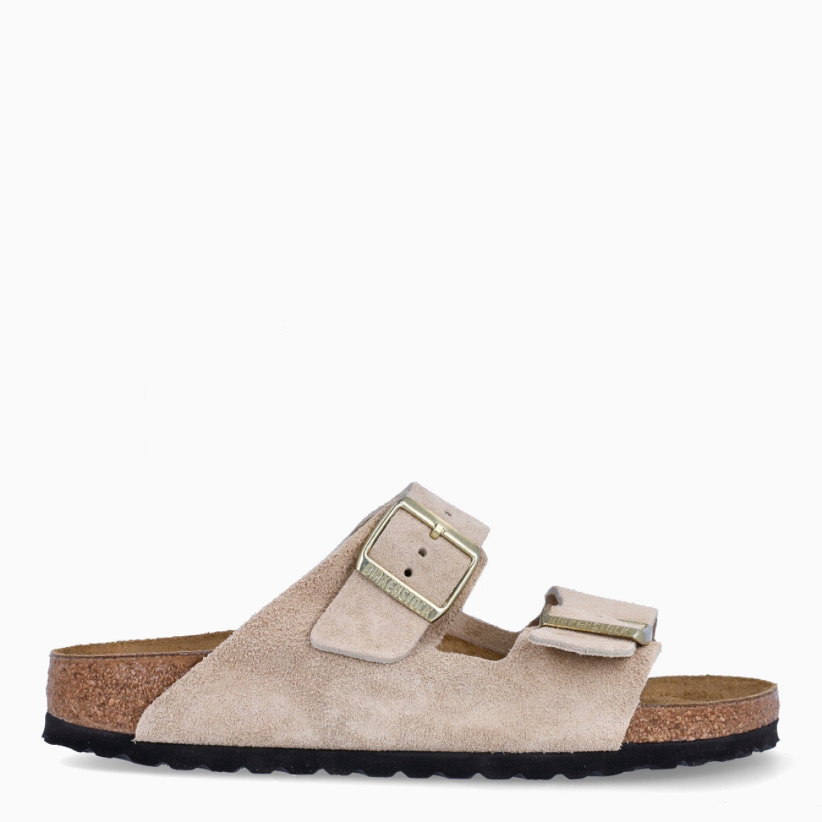 Sandalias de la marca Birkenstock, modelo ARIZONA BIRKO. Sandalias elaboradas en ante de color beig con una base de corcho y látex de forma anatómica. Cierre de las sandalias con doble hebilla de espiga de metal con ajuste individual. Estas sandalias Birkenstock ARIZONA BIRKO es un complemento clásico para tus looks de temporada, con un diseño sencillo atemporal y una ligereza que te dará la comodidad que necesitas en tu día a día.