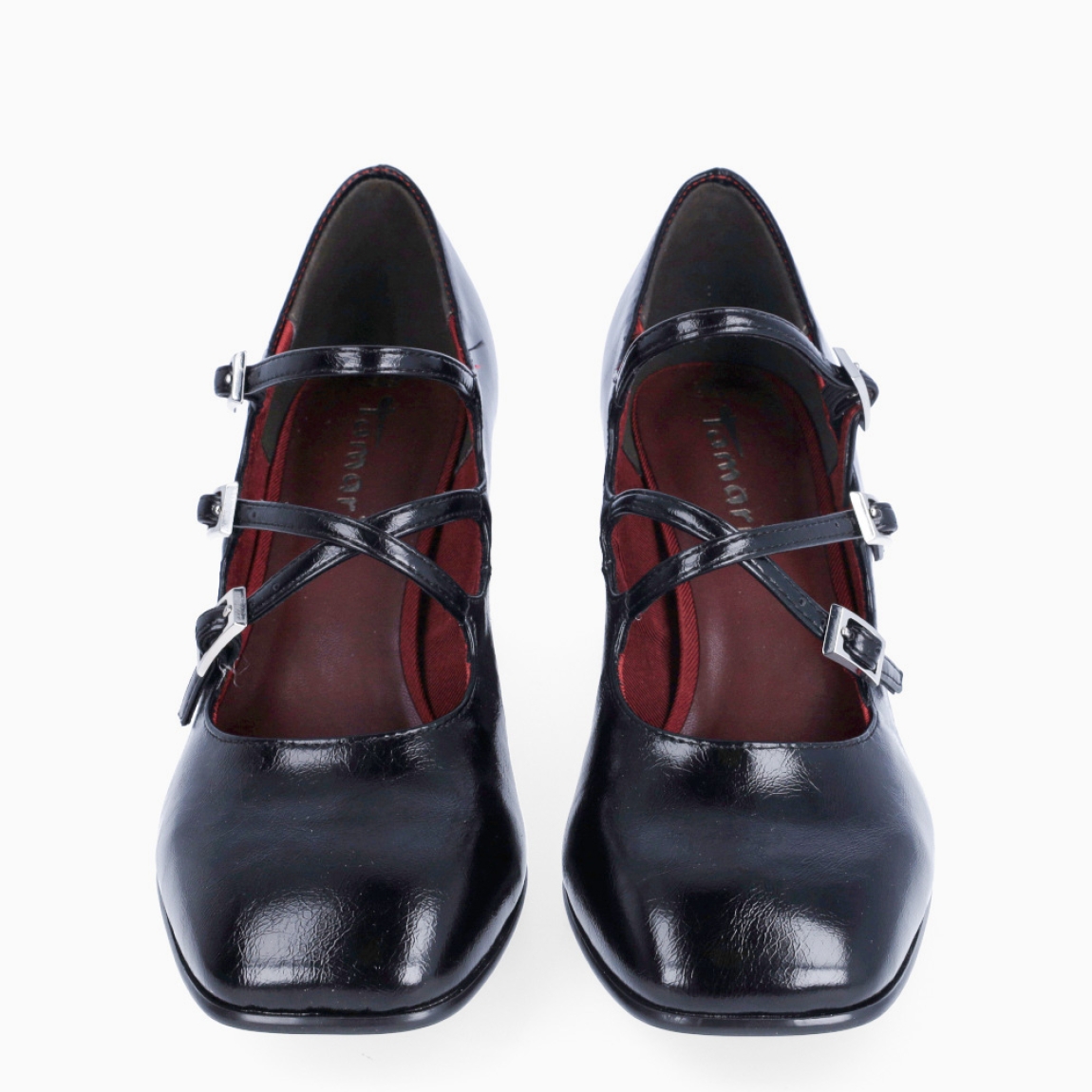 Merceditas de la marca Tamaris, modelo ELIOTT. Exterior en piel color negro con punta cuadrada. Interior en piel color rojo. Cierre con tres hebillas cruzadas en pala. Merceditas Tamaris con tacón de 6cm de altura. Estas merceditas Tamaris ELIOTT son ideales para esta temporada!