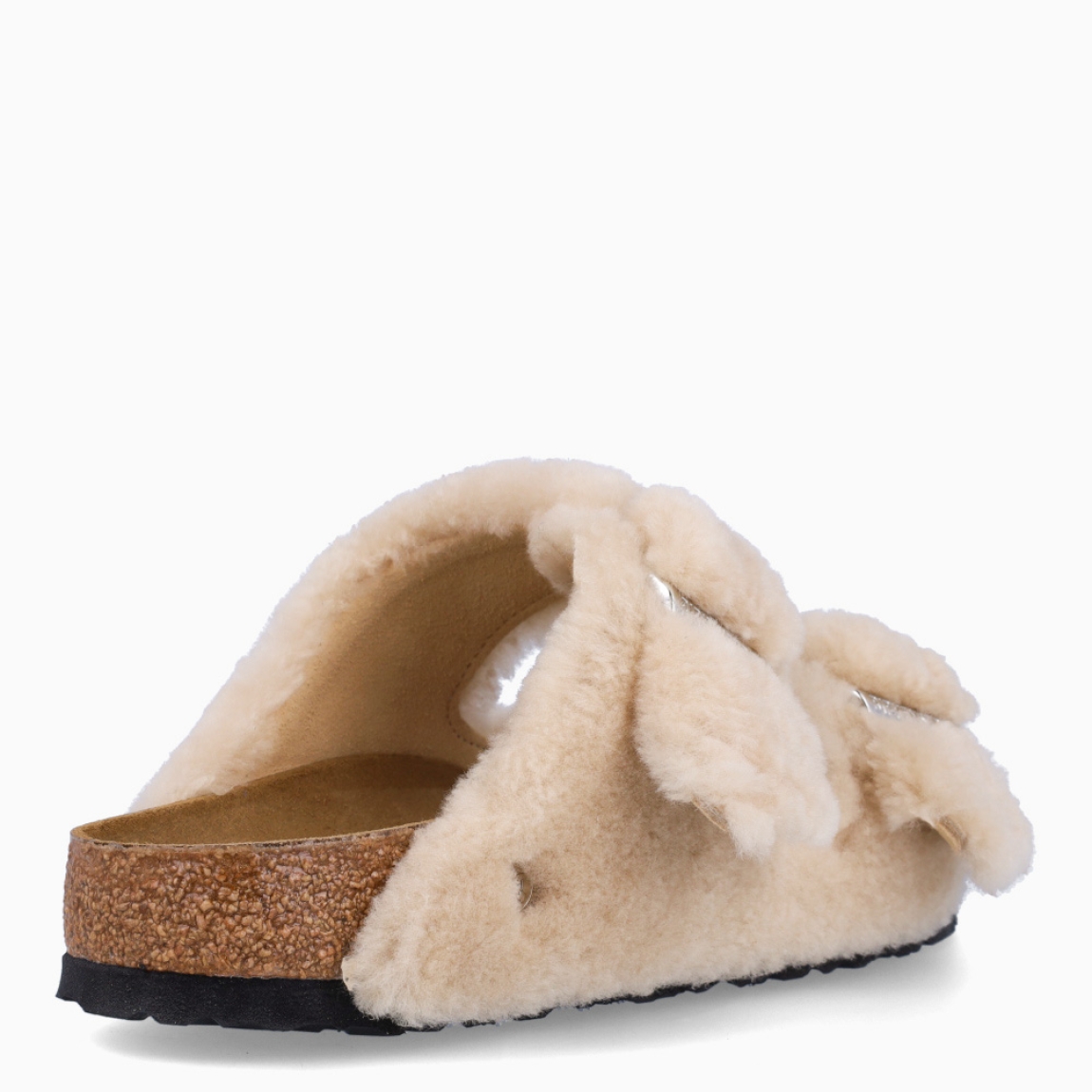 Zapatillas de la marca Birkenstock, modelo ARIZONA SHEAR. Zapatillas elaboradas en lana de color camel con una base de corcho y látex de forma anatómica. Cierre de las zapatillas con doble hebilla de espiga de metal con ajuste individual. Estas zapatillas Birkenstock ARIZONA SHEAR es un complemento ideal, con una ligereza que te dará la comodidad que necesitas en tu día a día.