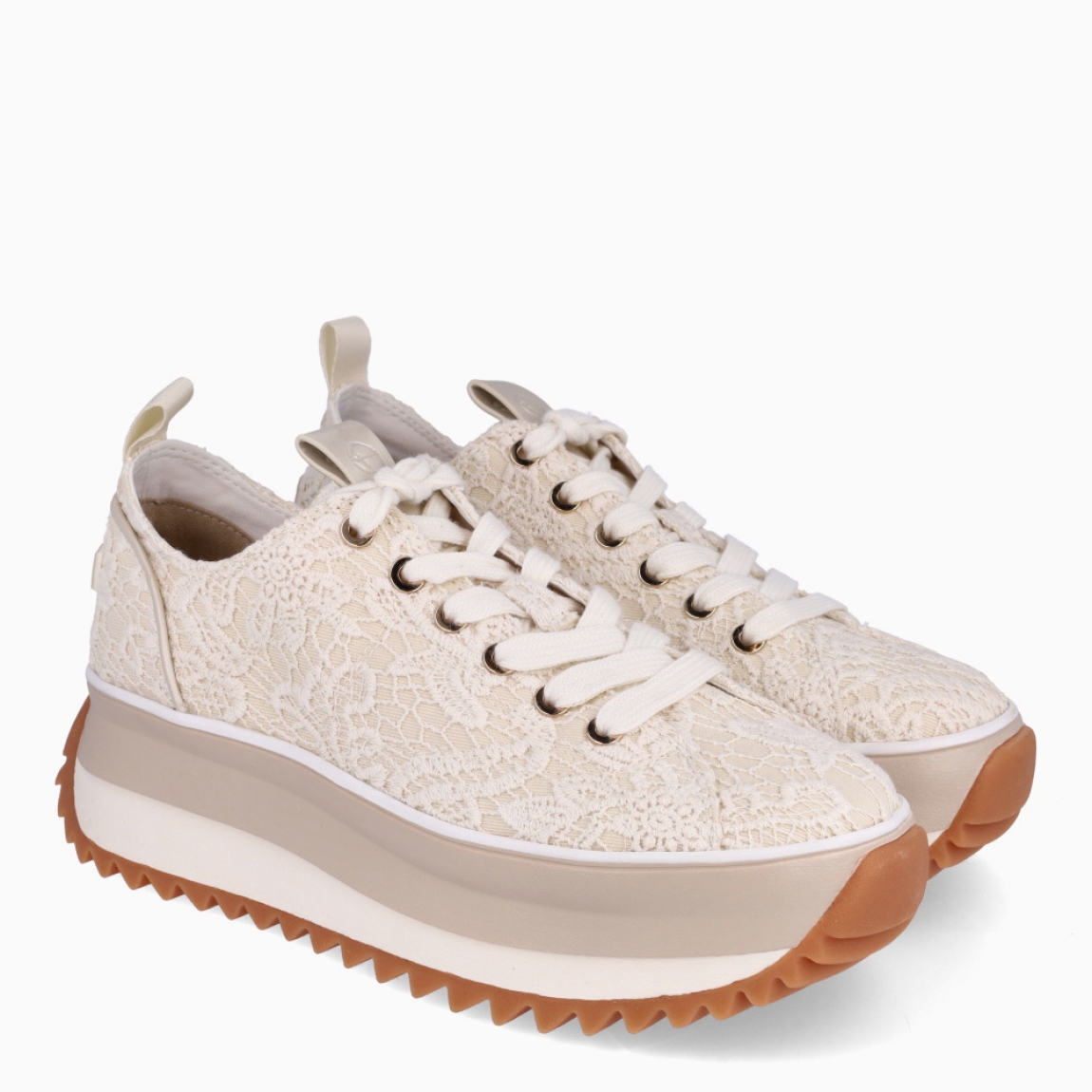 Depotivas de la marca Tamaris, modelo RAFA. Exterior de las deportivas en lona con estampado de flores color crema. Interior de las deportivas en textil blanco. Cierre de las deportivas con cordones en color blanco. Suelas de las deportivas Tamaris hechas de goma y dentadas. Deportivas con plataforma de 4cm de altura. Estas deportivas Tamaris Rafa, además de se cómodas, tienen un estilo único que te ayudarán a destacar en tu día a día.