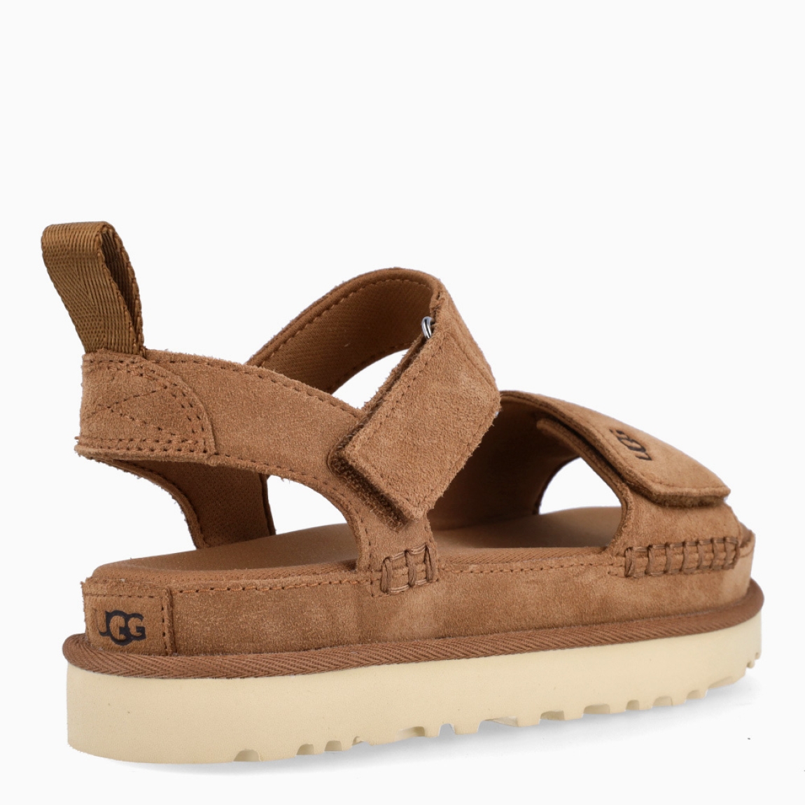 Sandalias de la marca UGG, modelo GOLDENSTAR. Sandalias elaboradas en ante color cuero. Forro textil de fibras de poliéster 100 % reciclado, forro de microfibra. El tejido de la plantilla está fabricado con fibras de poliéster 100 % reciclado, la plantilla cuenta con un tratamiento antiolores a base de menta. Cierre de estas sandalias UF co veñcrp en el tobillo y empeine. Entresuela de EVA de caña de azúcar reciclada. Suela de goma EVA de caña de azúcar. Sandalias UGG GOLDENSTAR es un complemento básico e ideal en comodidad!