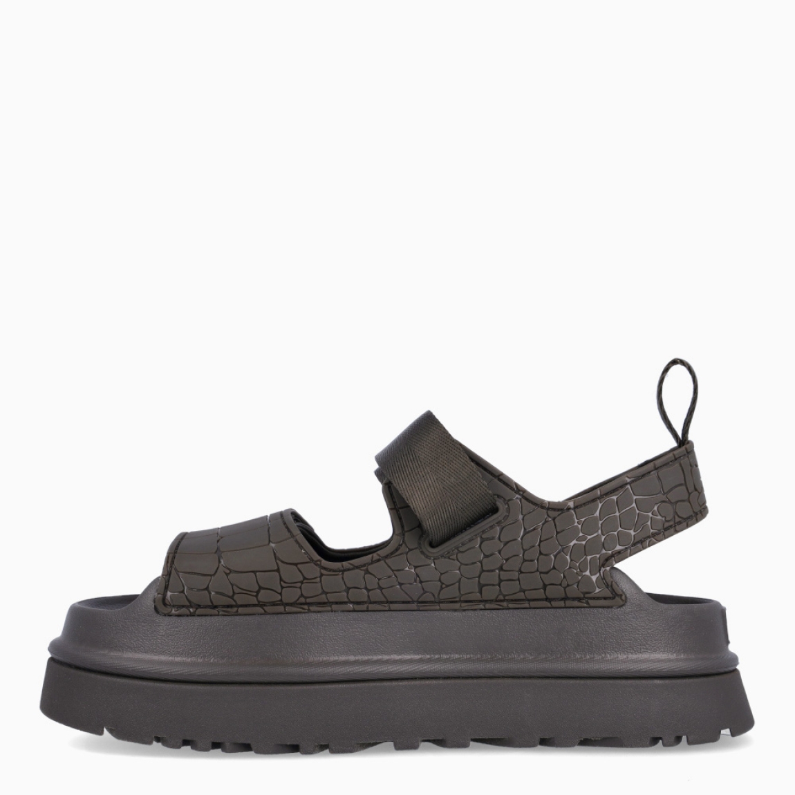 Sandalias de la marca UGG, modelo GOLDENGLOW. Sandalias con forro del empeine fabricado con fibras de poliéster 100 % reciclado color verde con estampado de cocodrilo. Empeine de TPU grabado. Cierre de las UGG con velcro en pala y tobillo, las tiras están fabricadas con fibras de poliéster 100 % reciclado. Entresuela de EVA de caña de azucar. Suela de goma con plataforma. Estas sandalias UGG GOLDENGLOW son un complemento que te brindará una comodidad única!