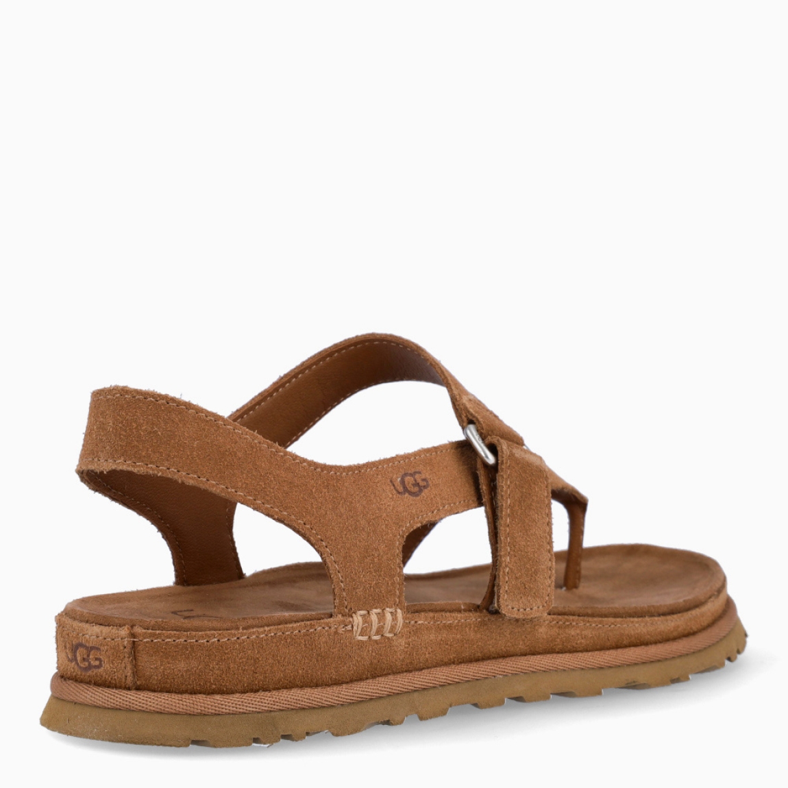 Sandalias esclava de la marca UGG, modelo GOLDENSTAR. Sandalias elaboradas en ante color cuero. Forro textil de fibras de poliéster 100 % reciclado, forro de microfibra. El tejido de la plantilla está fabricado con fibras de poliéster 100 % reciclado, la plantilla cuenta con un tratamiento antiolores a base de menta. Cierre de estas sandalias con tiras cruzadas y velcro en pala. . Entresuela de EVA de caña de azúcar reciclada. Suela de goma EVA de caña de azúcar. Sandalias esclava UGG GOLDENSTAR es un complemento básico e ideal en comodidad!