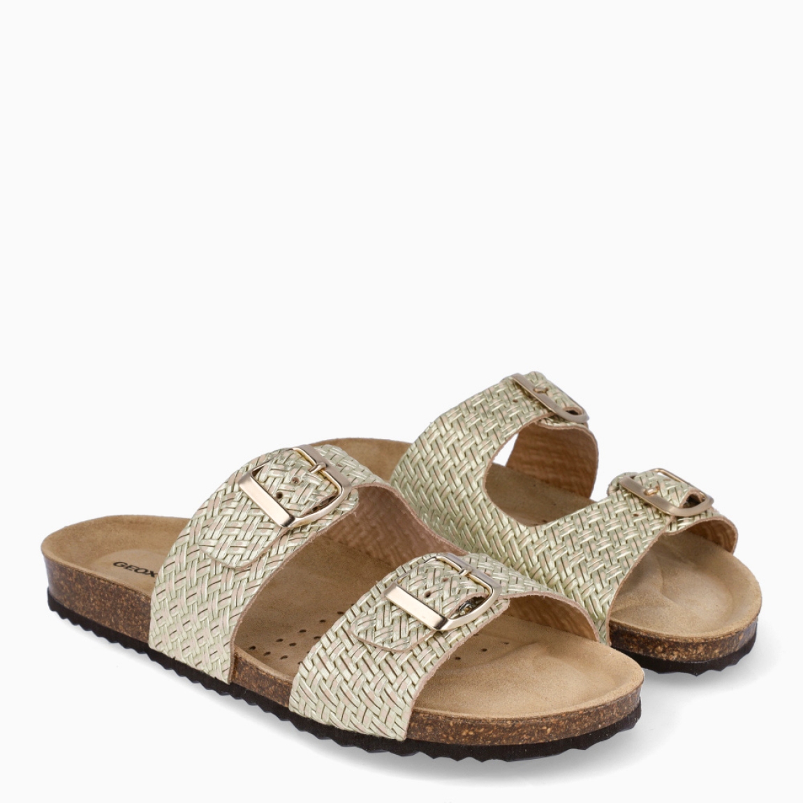 Sandalia para mujer de la marca Geox modelo BRUNNA. Elaborada en piel color oro con detalle de doble tiras en pala, de estilo diario, que garantiza confort y transpirabilidad durante todo el día. Cierre con doble hebilla en pala. Este modelo, cuenta con una empella de suave gamuza. Ideal para la ciudad, BRUNNA está pensada para añadir un toque moderno a los looks de verano.