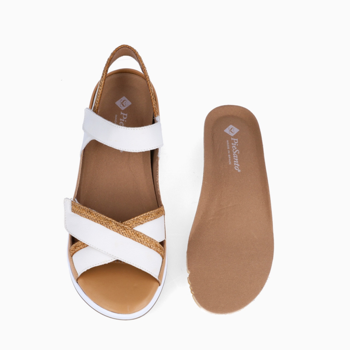 Sandalias de la marca PieSanto, modelo MARYELL. Exterior de las sandalias en piel color blanco con tiras cruzadas . Interior de las sandalias en piel color camel, con plantilla acolchada y extraíble para máxima comodidad. Cierre de las sandalias PieSanto con doble velcro en pala y empeine. Sandalias con plataforma de 5cm de altura. Estas sandalias PieSanto MARYELL son un complemento de temporada ideal para tu día a día, gracias a su ligereza, comodidad y diseño.