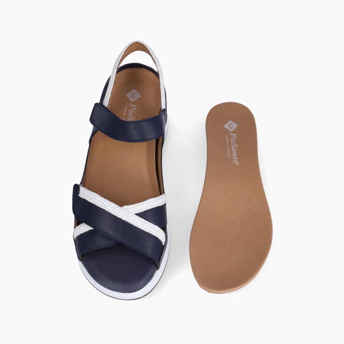 Sandalias de la marca Piesanto, modelo LONNA. Elaboradas en piel color azul marino con detalle en blanco y tiras cruzadas en pala. Interior con plantilla acolchada y extraíble para máxima comodidad. Suela con plataforma de 6cm de altura. Sandalias Piensanto LONNA, complemento ideal de comodidad para tu día a día!