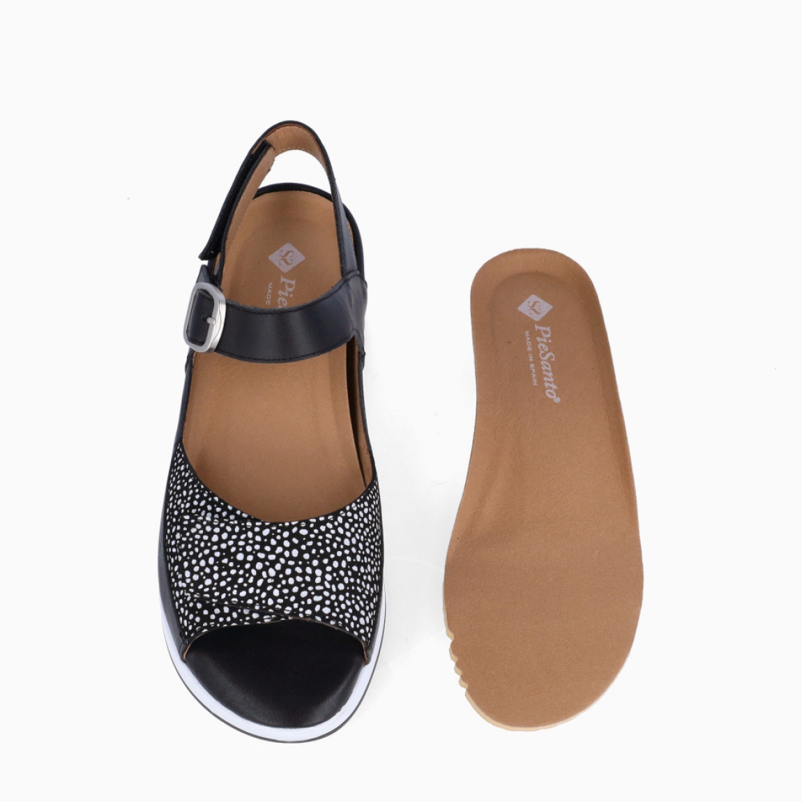 Sandalias de la marca Piesanto, modelo MAJU. Elaboradas en piel color negro con detalle en estampado y tira con velcro en pala. Interior con plantilla acolchada y extraíble para máxima comodidad. Suela con plataforma de 5cm de altura. Cierre con velcro en pala y hebilla en tobillo. Sandalias Piensanto MAJU, complemento ideal de comodidad para tu día a día!