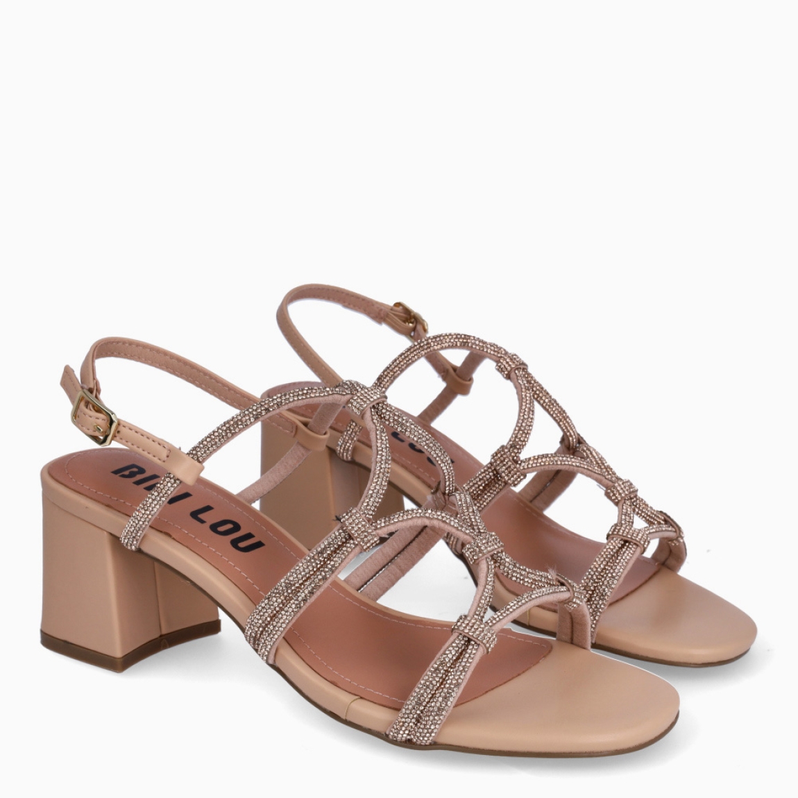 Sandalias de la marca BIBI LOU, modelo QUAIL. Sandalias elabordas en material sintético color nude, con punta redonda que aporta suavidad, mientras que los brillos decorativos en las tiras cruzadas de la pala añaden un toque luminoso y femenino. Sandalias BIBI LOU con cierre de hebilla en tobillo y suela plana de 2 cm, que esultan ligeras y cómodas para el uso diario. Estas sandalias BIBI LOU QUAIL son ideales para looks casuales, paseos de día o combinaciones urbanas con un toque refinado.