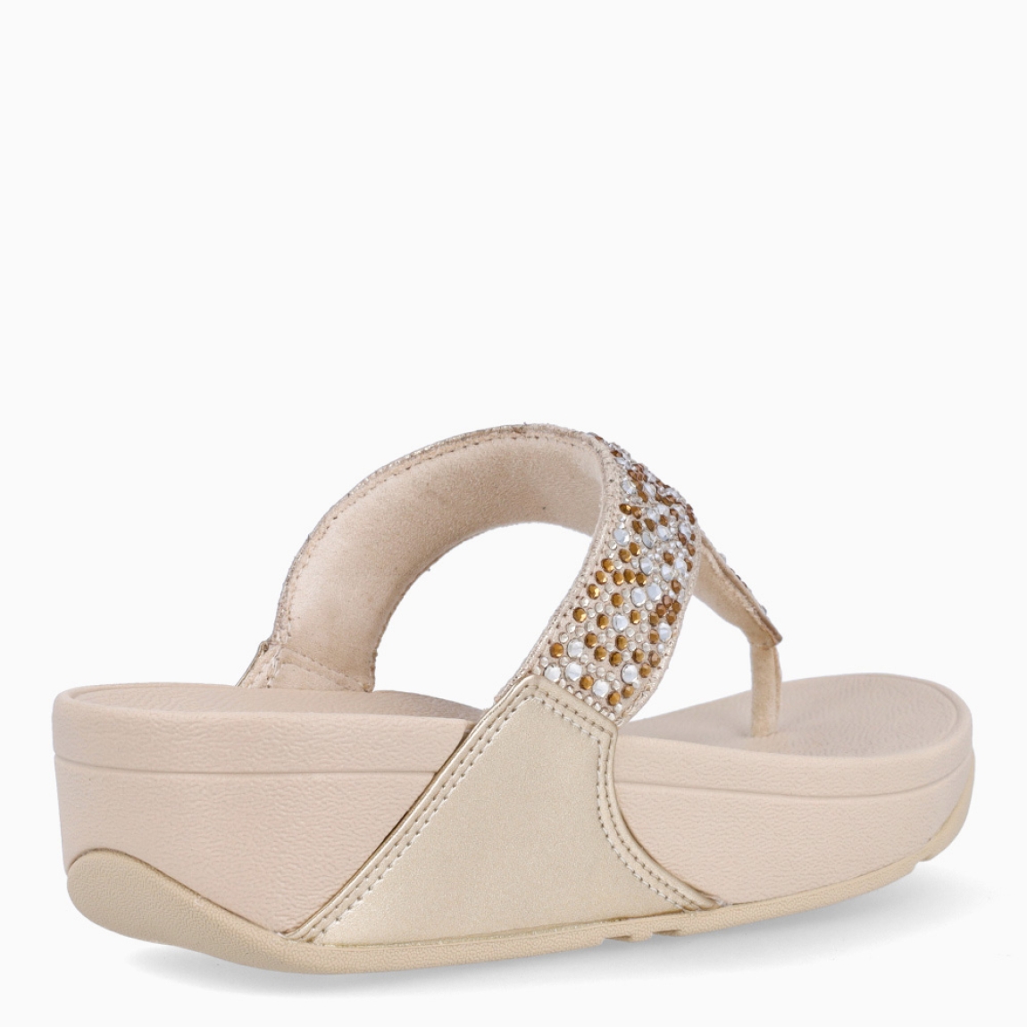 Sandalias de la marca Fitflop, modelo LULU. Sandalias elaboradas en neopreno color platino con brillantes en pala. Interior de esclavas en neopreno color nude. Suela de goma con una cuña de 6cm de altura. Estas sandalias Fitflop LULU son ideales para esta temporada!