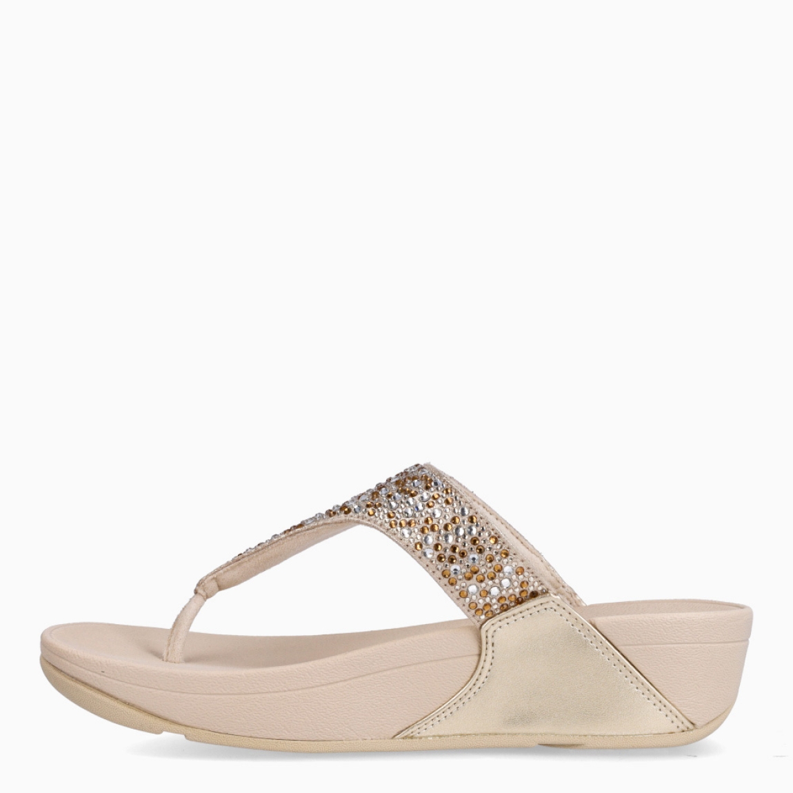 Sandalias de la marca Fitflop, modelo LULU. Sandalias elaboradas en neopreno color platino con brillantes en pala. Interior de esclavas en neopreno color nude. Suela de goma con una cuña de 6cm de altura. Estas sandalias Fitflop LULU son ideales para esta temporada!