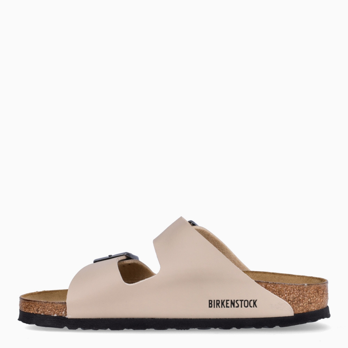 Sandalias de la marca Birkenstock, modelo ARIZONA BIRKO-FLOR. Sandalias elaboradas en ante color beig con una base de corcho y látex de forma anatómica. Cierre de las sandalias con doble hebilla de espiga de metal con ajuste individual. Estas sandalias Birkenstock ARIZONA BIRKO-FLOR es un complemento clásico para tus looks de temporada, con un diseño sencillo atemporal y una ligereza que te dará la comodidad que necesitas en tu día a día.