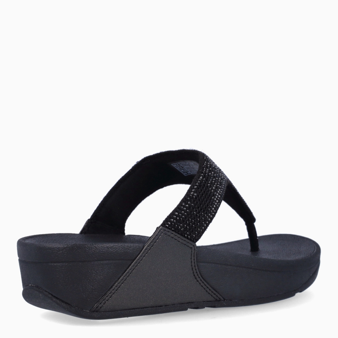 Sandalias de la marca Fitflop, modelo LULU. Sandalias elaboradas en neopreno color negro con brillantes en pala. Interior de esclavas en neopreno color negro. Suela de goma con una cuña de 6cm de altura. Estas sandalias Fitflop LULU son ideales para esta temporada!