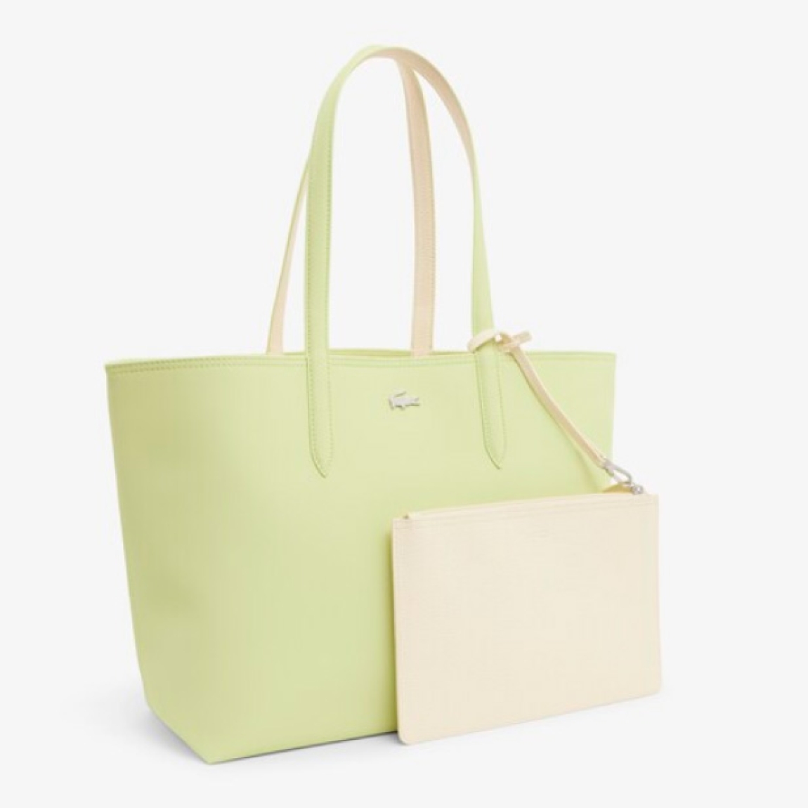 Bolso reversible de la marca Lacoste, modelo L12. Bolso diseñado para llevar al hombro, elaborado de plástico color verde y beig. Con capacidad suficiente para un portátil de 15