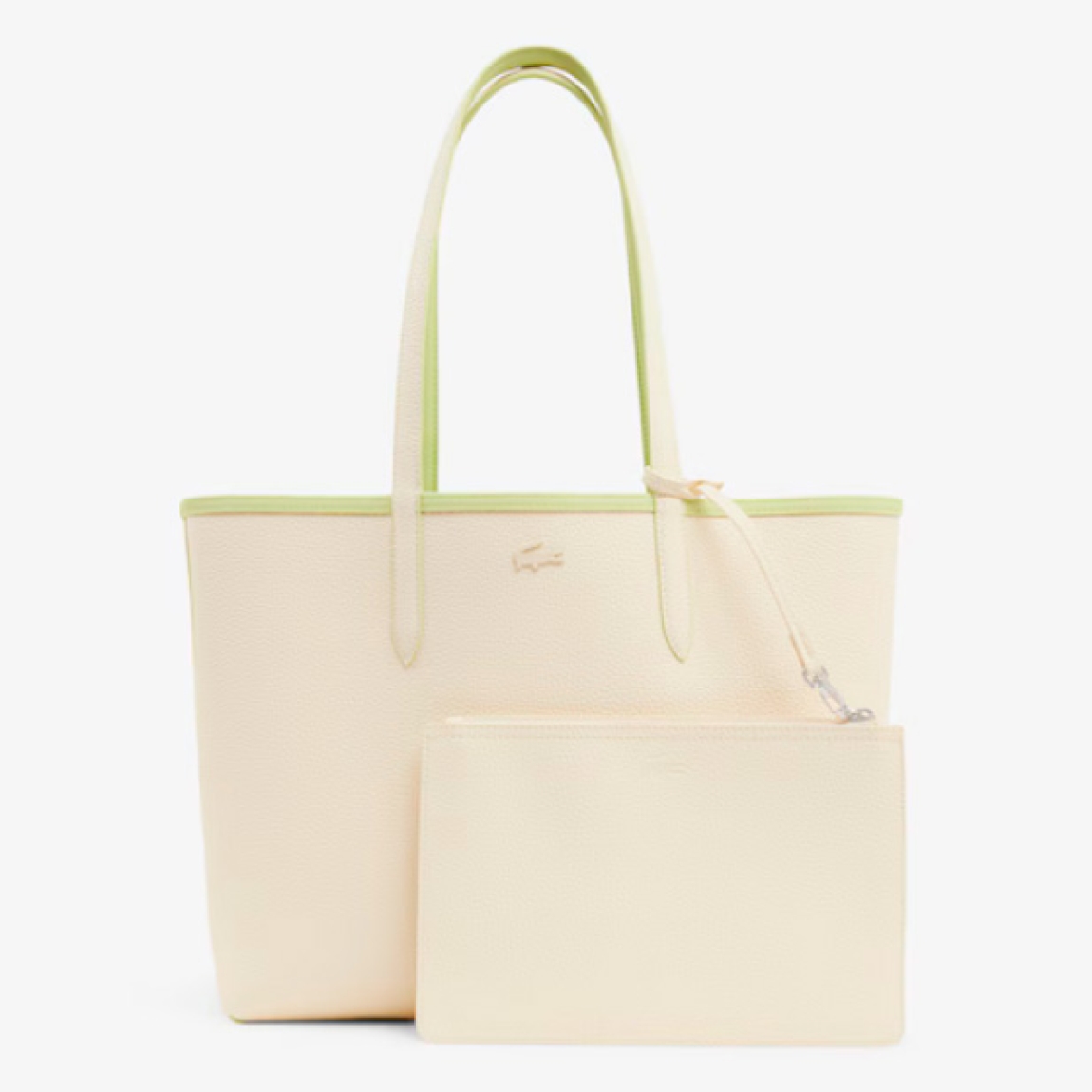 Bolso reversible de la marca Lacoste, modelo L12. Bolso diseñado para llevar al hombro, elaborado de plástico color verde y beig. Con capacidad suficiente para un portátil de 15
