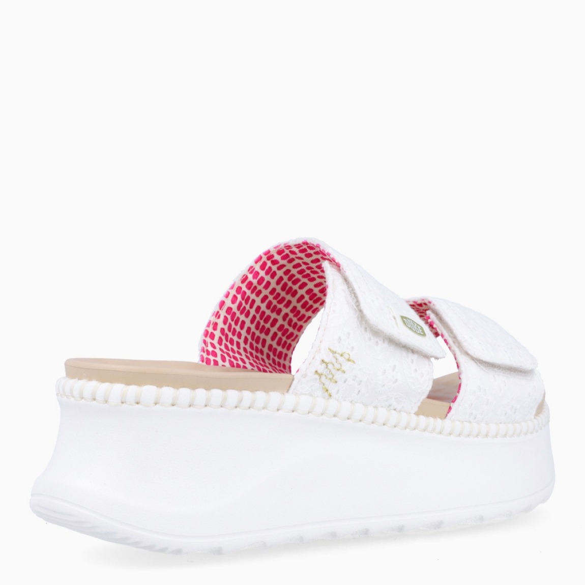 Sandalias de la marca Heydude, modelo DELRAY. Exterior elaborado en tela color blanco con diseños estampados. Interior en piel color nude. Cierre de sandailas Heydude con doble velcro en la pala. Sandalias con cuña de 5cm de altura. Estas sandalias Heydude DELRAY son un complento básico, clásico y cómodo para tu día a día!