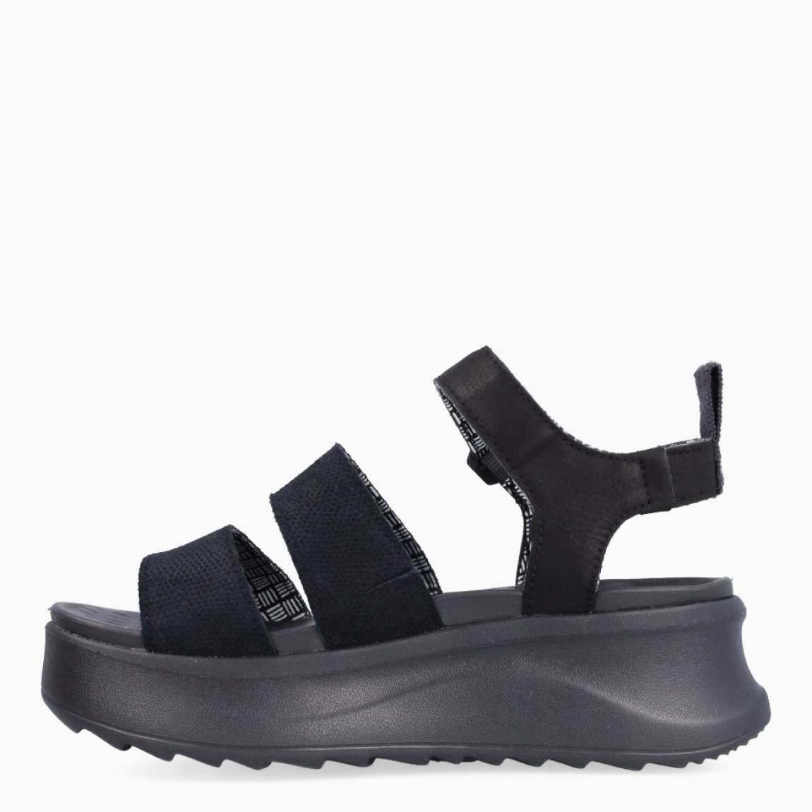 Sandalias de la marca Heydude, modelo DELRAY BUCKLE. Exterior elaborado en tela color negro. Interior en piel color negro. Cierre de sandaias Heydude con hebilla en tobillo. Sandalias con cuña de 5cm de altura. Estas sandalias Heydude DELRAY BUCKLE son un complento básico, clásico y cómodo para tu día a día!