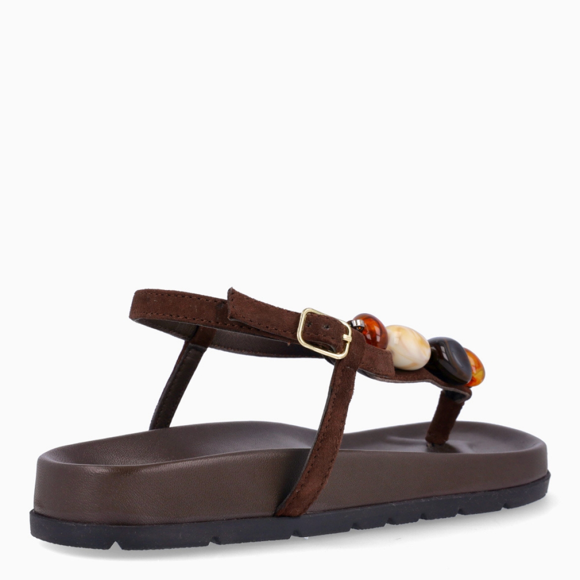 Sandalias de la marca Itse, modelo SAMOS. Sandalias elaboradas en piel color marrón oscuro. Sandalias esclavas con tiras cruzadas en pala y piedras en colores tierra. Cierre de sandalias Itse con hebilla. Suela plana y muy cómoda. Sandalias Itse SAMOS, complemento ideal para llevarlo en tu día día, con frescura y modernidad.