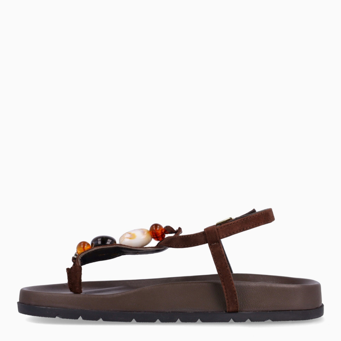 Sandalias de la marca Itse, modelo SAMOS. Sandalias elaboradas en piel color marrón oscuro. Sandalias esclavas con tiras cruzadas en pala y piedras en colores tierra. Cierre de sandalias Itse con hebilla. Suela plana y muy cómoda. Sandalias Itse SAMOS, complemento ideal para llevarlo en tu día día, con frescura y modernidad.