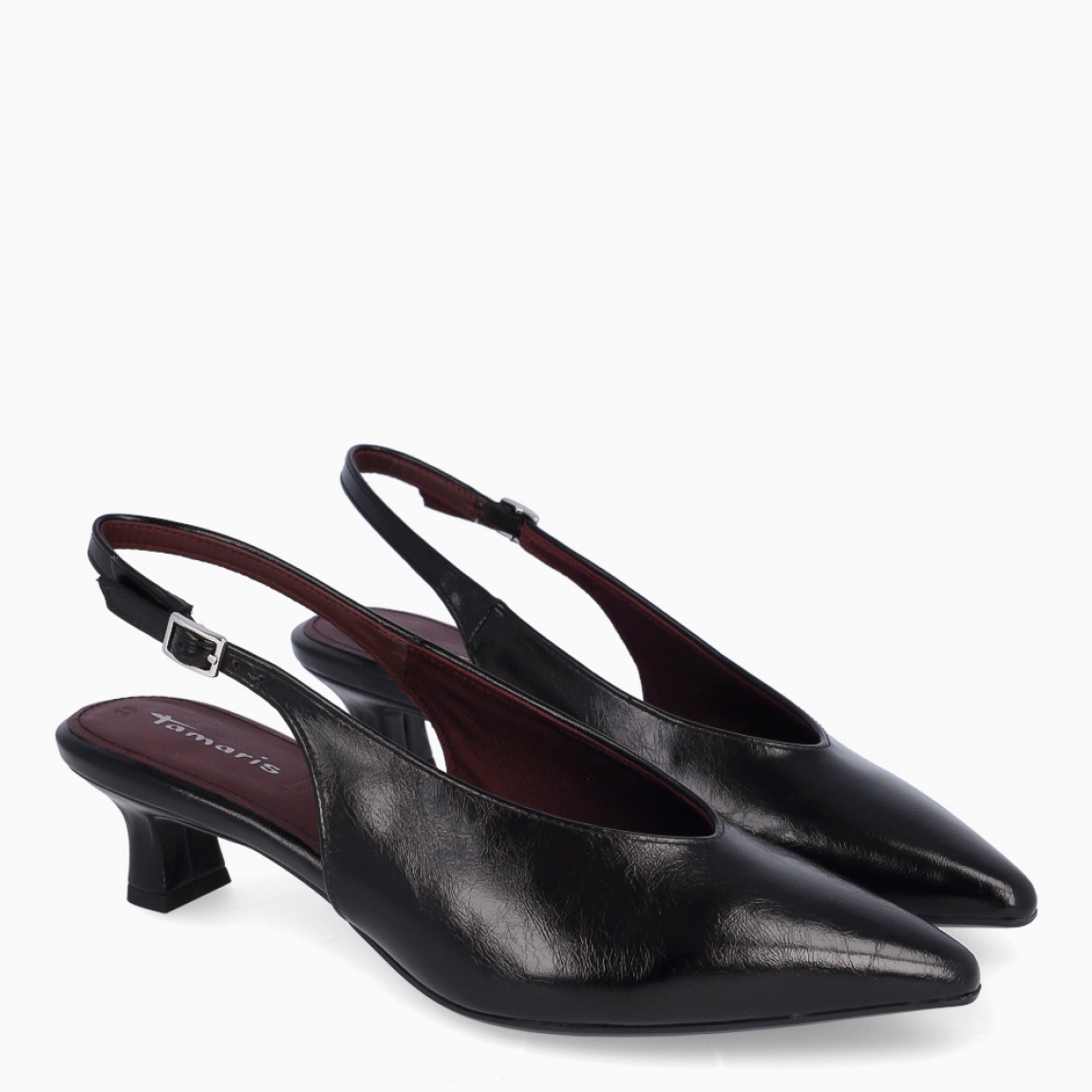 Los salones Tamaris QUEENIE combinan elegancia y comodidad en un diseño perfecto para cualquier ocasión. Están confeccionados en piel de color negro con un sofisticado acabado liso clásico. Incorporan un tacón de 4 cm de altura, ideal para proporcionar una ligera elevación y garantizar el confort durante largas jornadas. Su punta afilada realza la silueta del calzado con un aire refinado y femenino.Cuentan con cierre mediante hebilla ajustable para un ajuste seguro y personalizado, además de una plantilla suave que ofrece una mayor comodidad en cada paso.Los Tamaris QUEENIE son la opción perfecta para transformar cualquier look en un conjunto formal y elegante, sin renunciar a un estilo moderno y versátil.