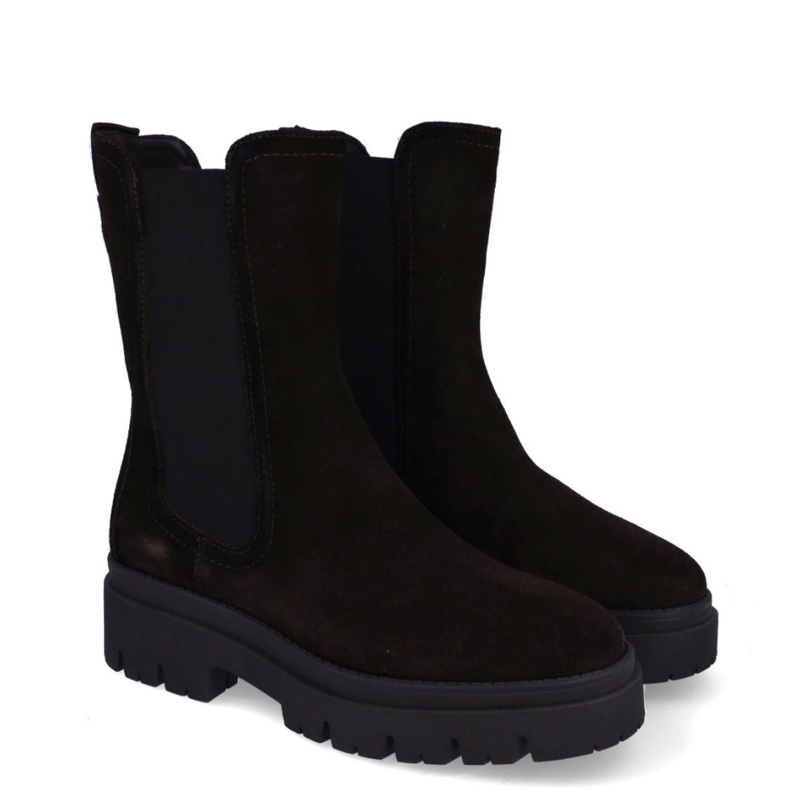 Botines chelsea de caña media de la marca Tamaris, modelo FOREST. Confeccionados en suave piel de ante en un profundo tono marrón oscuro, presentan un diseño depurado con elásticos laterales anchos y tirador trasero para un calce suave y rápido. Incorporan plantilla interior acolchada de alto confort y una suela track de goma dentada con cuña de 5 cm que aísla del frío y garantiza una pisada firme y estable. Combinan genial con tejanos anchos, pantalones de vestir o vestidos midi fluidos con abrigo de paño para un estilismo actual y favorecedor. ¡El fondo de armario imprescindible que aúna tendencia, altura y máxima comodidad!