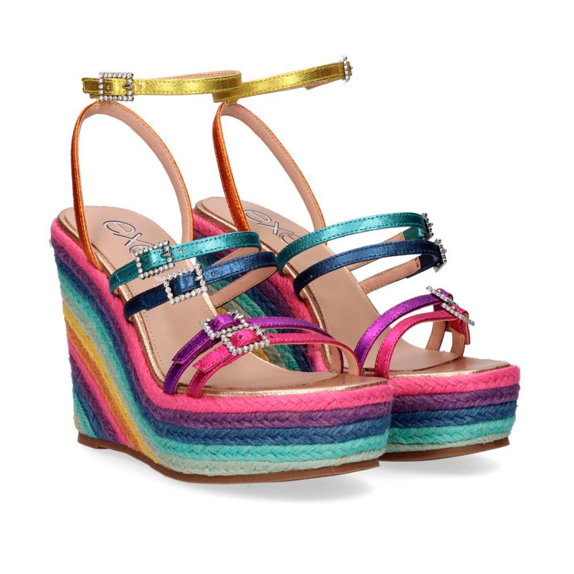 Sandalias de la marca Exe, modelo NAOMI-92. Exterior de las sandalias en piel multicolor con tiras. Interior de las sandalias en piel color beig. Cierre de las sandalias Exe con hebillas con pedrería brillante, en la pala, empeine y tobillo. Sandalias con cuña de 10cm de altura multicolor. Estas sandalias Exe NAOMI-927 traen los colores tendencia de temporada, así que no te puede faltar este complemento para crear looks divertidos, con estilo y comodidad.