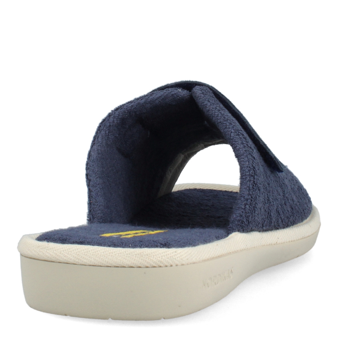 Zapatillas de la marca Nordikas, modelo TOP LINE. Exterior e interior de las zapatillas en toalla color azul. Cierre de las zapatillas con velcro y suela de goma plana. Estas zapatillas Nordikas TOP LINE, te hará disfrutar de la comodidad y ligereza de estar por casa.