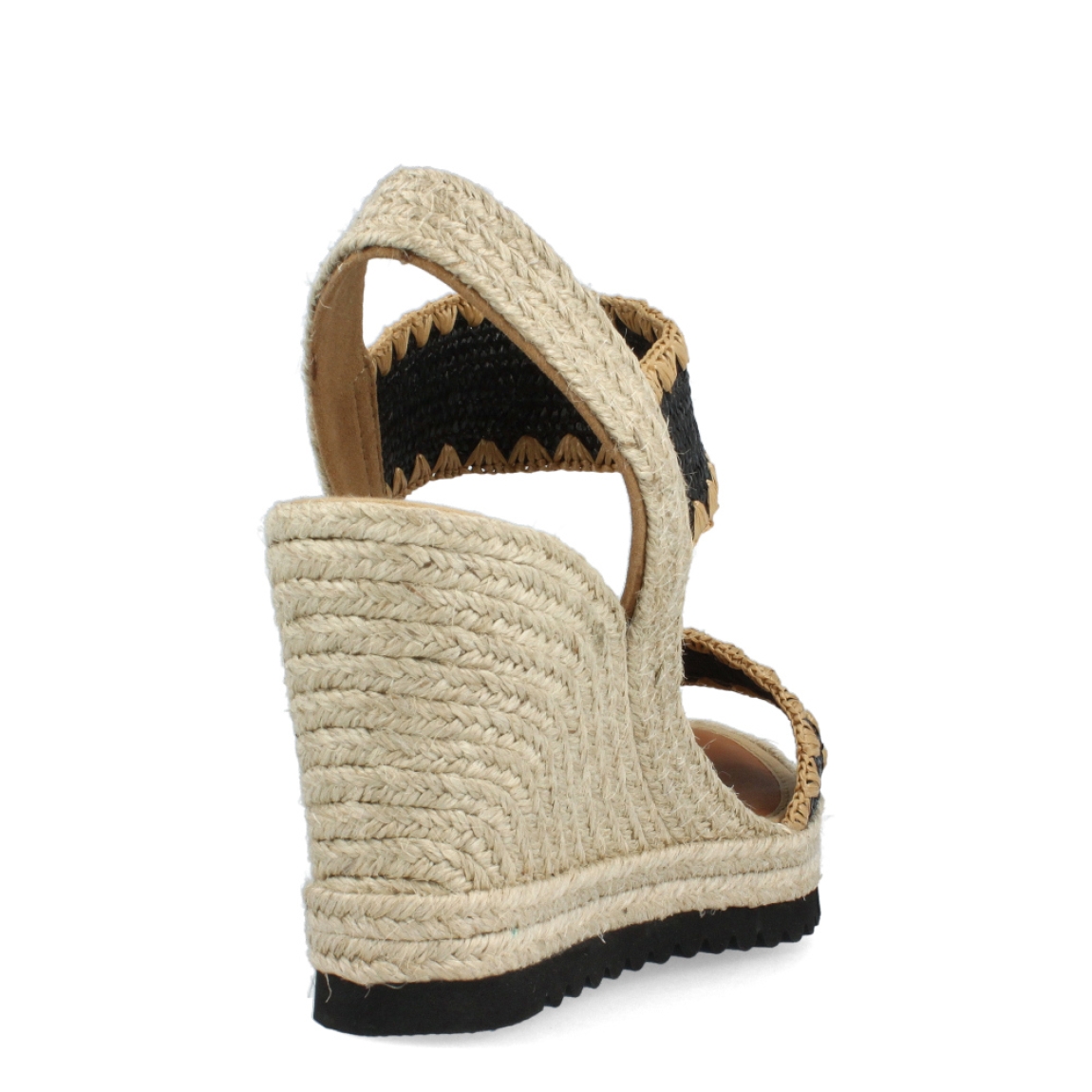 Alpargatas de la marca Casteller, modelo ELVA. Exterior de las alpargatas en rafia trenzada color negro y beig. Interior de las alpargatas en piel color camel. Alpargatas con cuña de 8cm de altura. Estas Alpargatas Casteller ELVA son el complemento perfecto para esta temporada. Te ayudará a estilizar el look con la máxima comodidad posible.