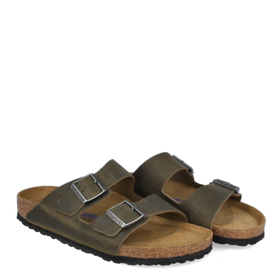 Sandalias de la marca Birkenstock, modelo ARIZONA BIRKO-FLOR. Sandalias elaboradas en neopreno de alta calidad de color verde con una base de corcho y látex de forma anatómica. Cierre de las sandalias con doble hebilla de espiga de metal con ajuste individual, en empeine y pala. Estas sandalias Birkenstock ARIZONA BIRKO-FLOR son un complemento ideal para esta temporada, su diseño simple atemporal, lo hace el accesorio clásico para tus looks!