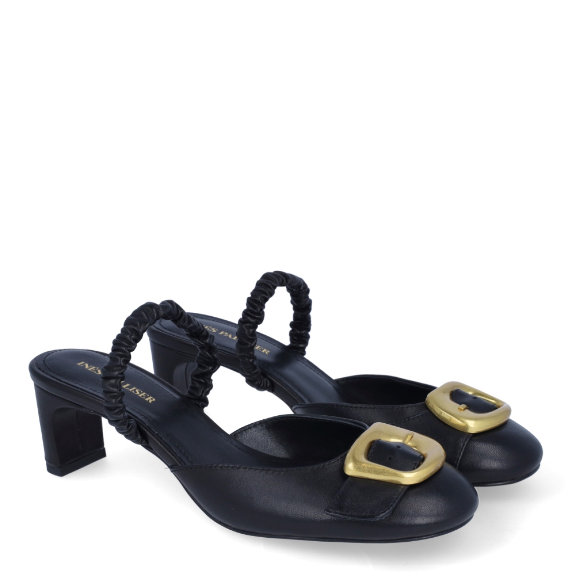 Salones destalonados de la marca Ines Palliser, modelo NICO. Exterior en piel color negro con punta redonda y detalle de hebilla color dorado en pala. Interior en piel color negro. Salones con tacón de 5cm de altura. Estos salones Ines Palliser NICO son unas clásicas, ideales para usar tanto como salones o muler darle el look de elegancia y comodidad a tus looks!