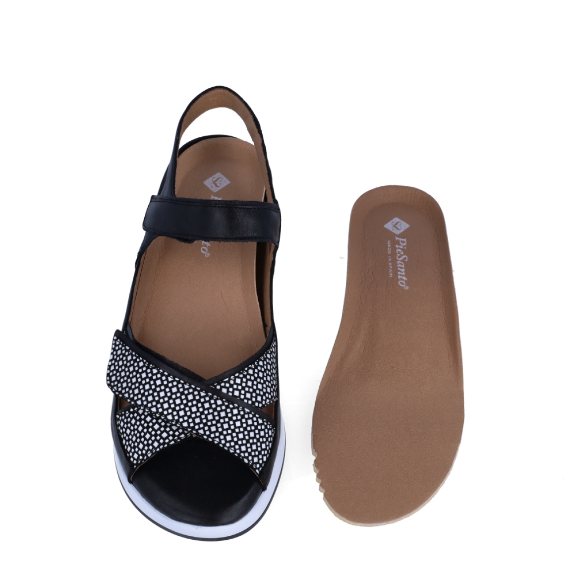 Sandalias de la marca PieSanto, modelo MELI. Exterior de las sandalias en ante color negro con tiras en pala cruzadas. Interior de las sandalias en piel color beig, con plantilla acolchada y extraíble para máxima comodidad. Cierre de las sandalias PieSanto con doble velcro y cuña de 5cm de altura. Estas sandalias PieSanto MELI son un complemento ligero y perfecto para esta temporada. No te puede faltar en el armario.