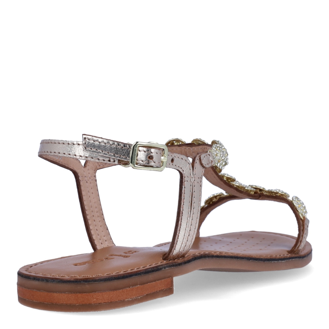 Sandalias de la marca Geox, modelo MEDA. Exterior en piel color oro con aplicaciones de brillantes. Interior en piel color camel. Cierre de sandalias Geox con hebilla. Sandalias con suela plana. Estas sandalias Geox MEDA son unas clásicas, que darán a tu look un estilo único!