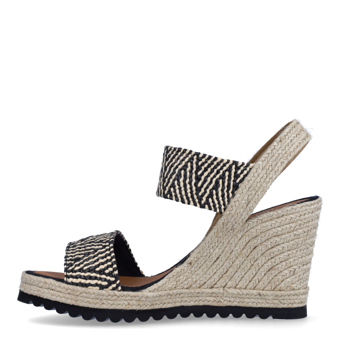Alpargatas de la marca Casteller, modelo BLUMA. Exterior de las alpargatas en textil con efecto corrugado multicolor entre blanco y negro con diseño. Interior de las alpargatas en piel color camel. Alpargatas con cuña de 8cm de altura. Estas alpargatas Casteller BLUMA son una tendencia de temporada. Gracias a su diseño, podrás estilizar tus looks con la máxima comodidad posible.