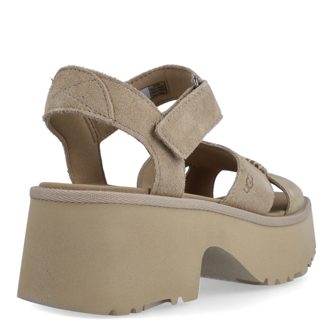 Sandalias de la marca UGG, modelo ANKLE STRAP. Exterior en ante color camel con tiras cruzadas en pala. Interior en piel color camel. Cierre de sandalias Alpe con velcro en tobillo. Sandalias con tacon cuña a de 6cm de altura y 4cm de plataforma. Estas sandalias UGG ANKLE STRAP es un complemento ideal para tus looks de temporada!
