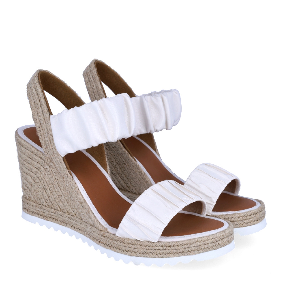 Alpargatas de la marca Casteller, modelo BLUMA. Exterior de las alpargatas en piel con efecto corrugado color blanco. Interior de las alpargatas en piel color camel. Alpargatas con cuña de 8cm de altura. Estas alpargatas Casteller BLUMA son una tendencia de temporada. Gracias a su diseño, podrás estilizar tus looks con la máxima comodidad posible.