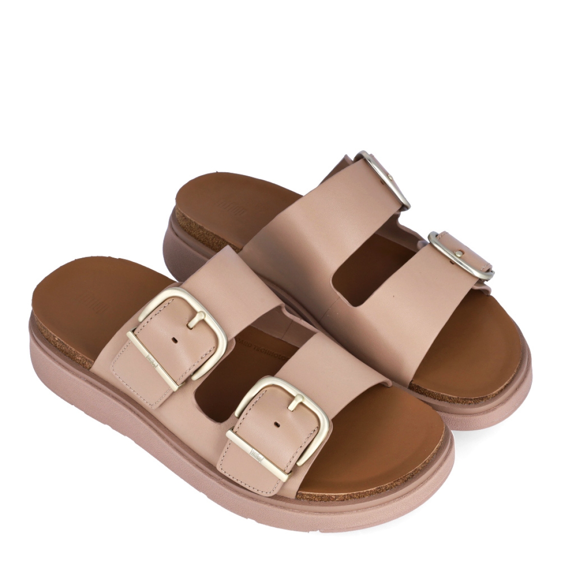 Sandalias de la marca Fitflop, modelo GEN-FF. Exterior elaborado en piel color nude. Interior en piel color camel. Cierre de sandalias fitflop con doble hebilla en la pala de color dorado. Sueala como cuña de 4cm de atura. Estas sandalias Fitflop GEN-FF son ideales para esta temporada!