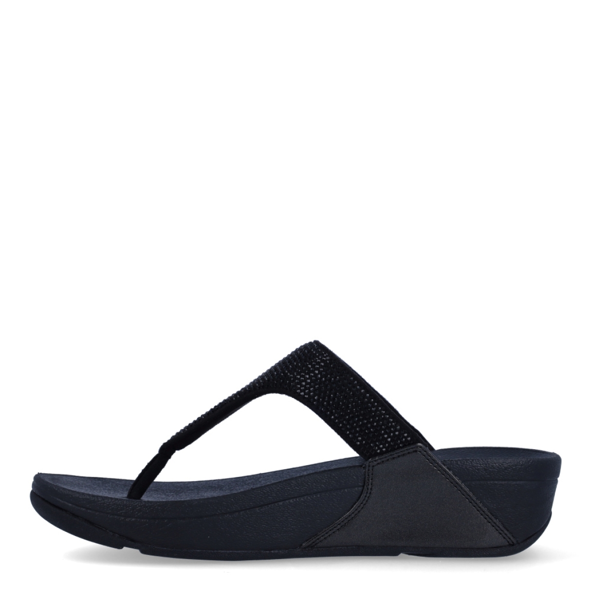 Sandalias de la marca Fitflop, modelo Lulu Crystal. Exterior en ante color negro, decorado con brillantes. Interior en microfibra de color taupe. Suela de caucho antideslizante y planta acolchada. Cuña de 4 cm incluyendo 2,5 cm de plataforma. Con detalle de piel sintética perlada metalizada en los laterales. Fabulosas de día y de noche.