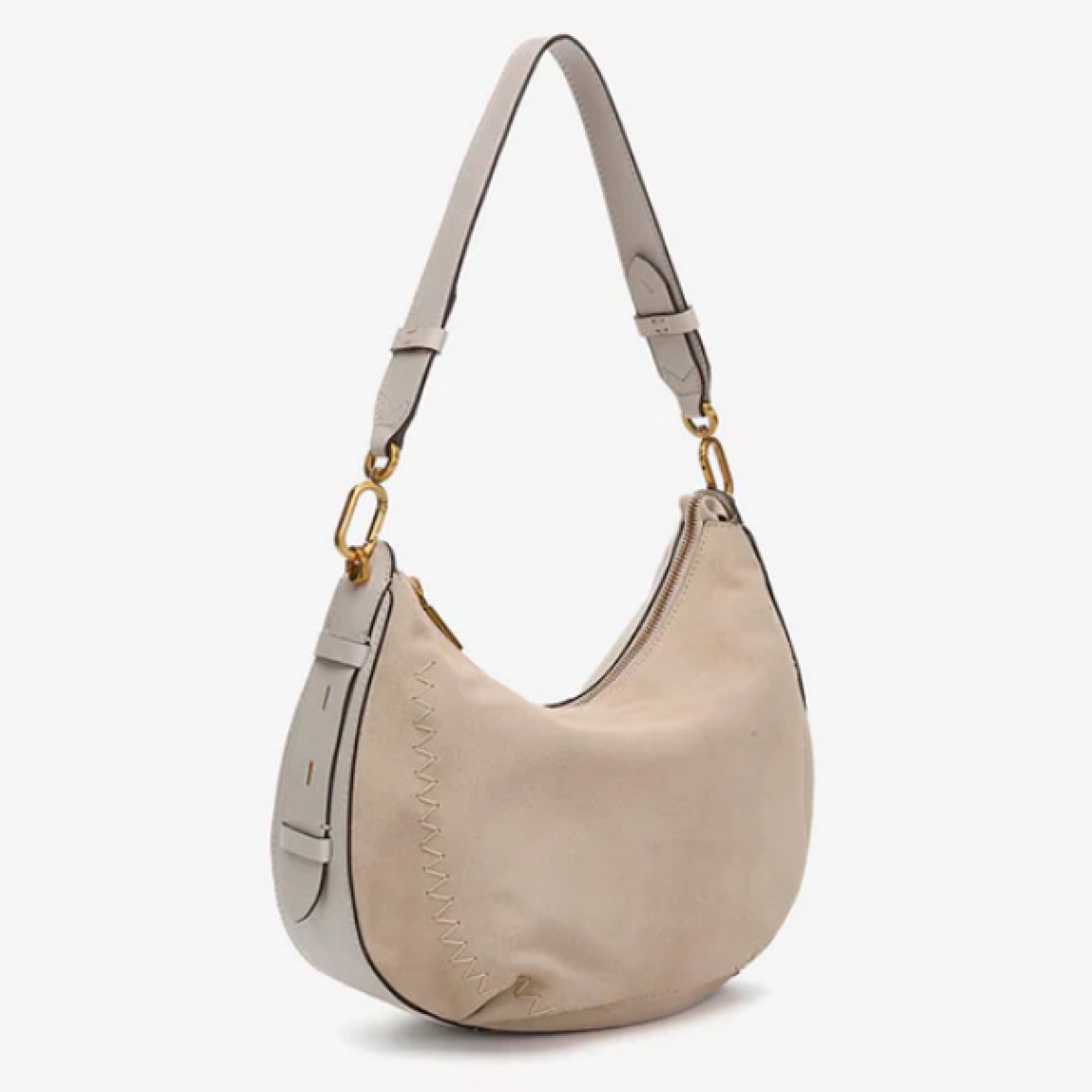 Bolso de hombro de la marca Abbacino, modelo BRUNA. Exterior en piel de ante color beig. En su frontal, destacan grandes pespuntes que combinan con su tono principal. Forro interior. Cierre con cremallera. Este bolso Abbacino BRUNA es un modelo en colores atemporales y muy fáciles de combinar que refleja elegancia y un aire clásico.
