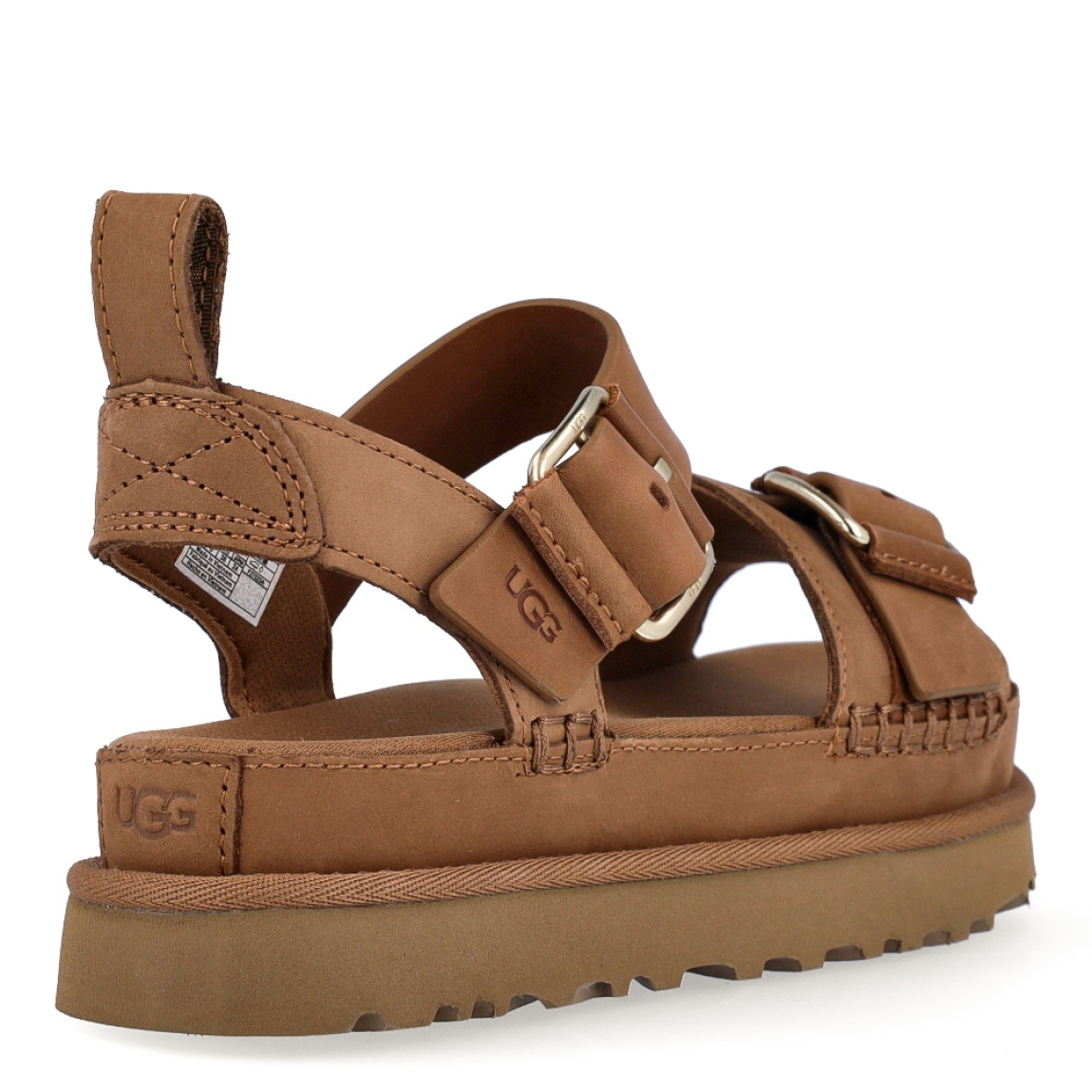 Sandalias de la marca UGG, modelo Goldenstar Villa. Elaboradas en piel color marrón con tiras en la pala. Estas sandalias UGG son ligeras y muy cómodas gracias a la suela de EVA de caña de azúcar y la plantilla contorneada, que las hacen ideales para explorar la ciudad o cualquier otro destino. Las tiras están hechas de una combinación de nobuk suave y piel auténtica y cuentan con una hebilla ajustable en el tobillo para que las adaptes como quieras. Con plataforma de 4cm de altura. Estas UGG Goldenstar Villa, que cuentan con elementos emblemáticos como los ribetes con costuras y detalles de pespunte cuadrado, te permiten disfrutar de la increíble sensación UGG® también durante los meses más cálidos.
