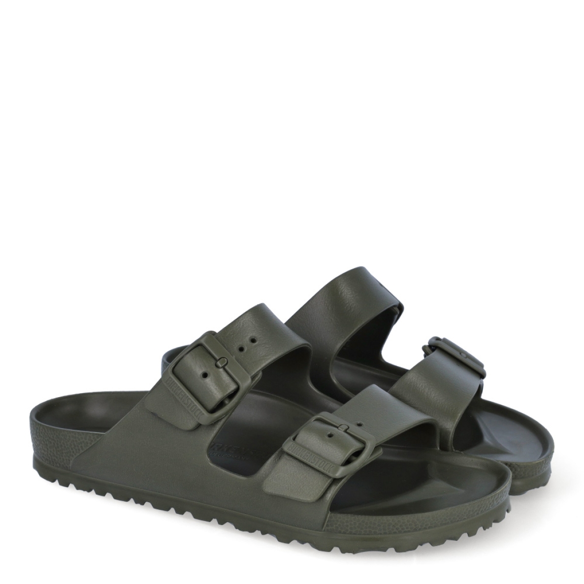 Sandalias de la marca Birkenstock, modelo ARIZONA EVA. Sandalias elaboradas en neopreno de alta calidad color verde oscuro. Cierre de las sandalias con dos hebillas, en el empeine y la pala. Sandalias Birkenstock con suela plana y de goma. Estas sandalias Birkenstock ARIZONA EVA son un complemento clásico para tus looks de temporada. No te puede faltar en el armario.