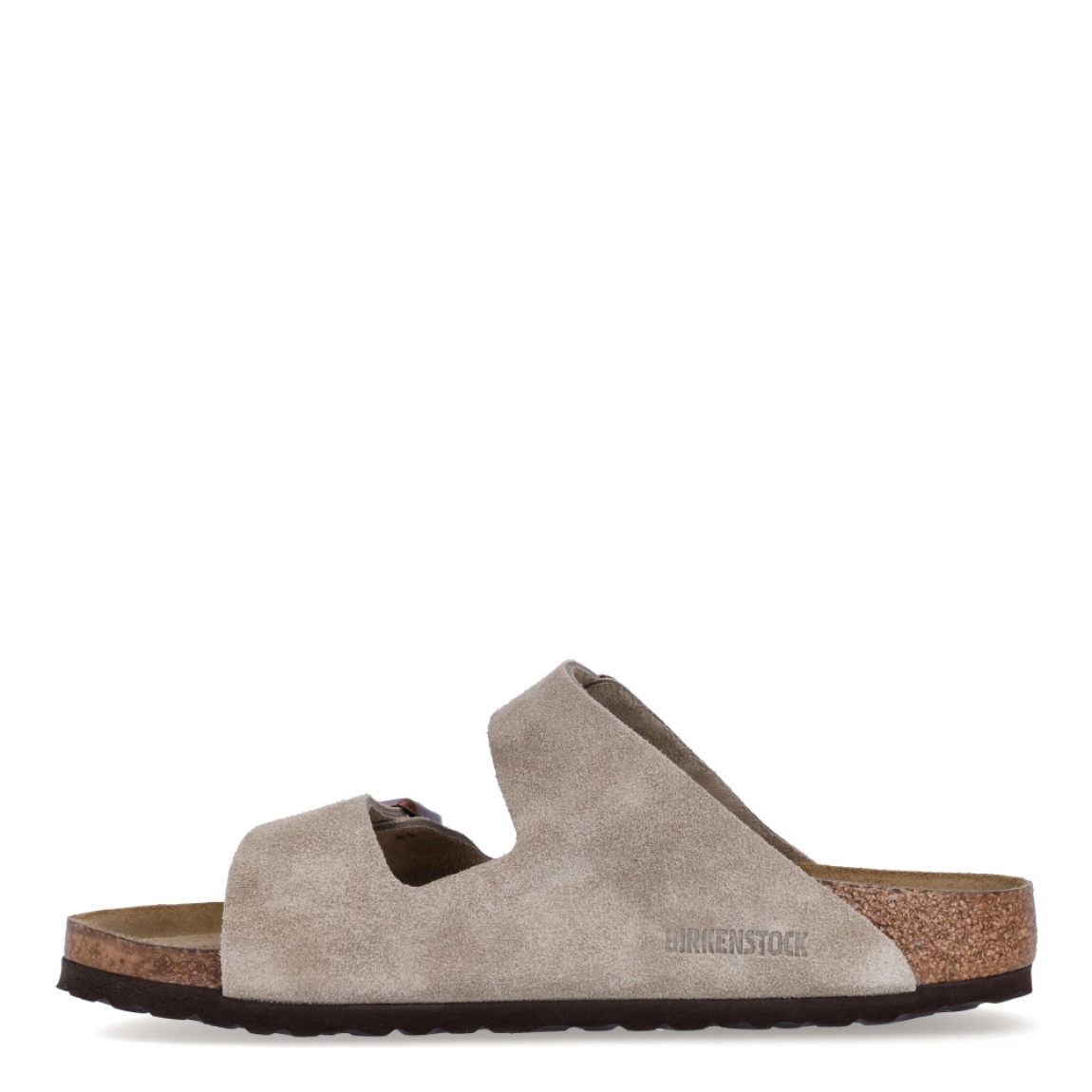 Sandalias de la marca Birkenstock, modelo ARIZONA BIRKO. Sandalias elaboradas en ante de alta calidad color taupe, con base de corcho y látex de forma anatómica. Cierre de las sandalias con doble hebilla de espiga de metal con ajuste individual, en empeine y pala. Estas sandalias Birkenstock ARIZONA BIRKO son un complemento ideal para esta temporada, su diseño simple atemporal, lo hace el accesorio clásico para tus looks!