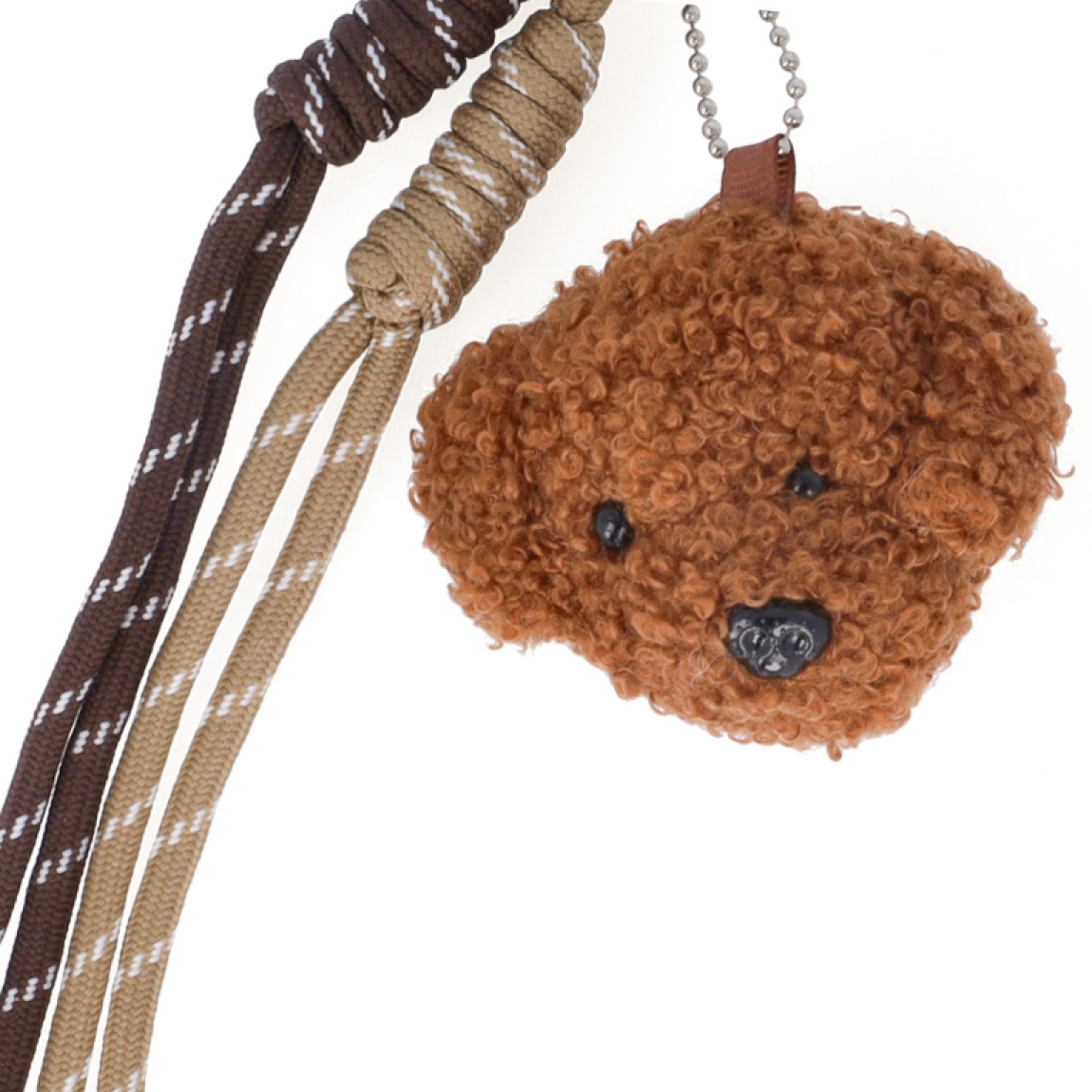 Llavero de la marca Munné, modelo OSI. Llavero elaborado en piel color marrón con adorno de osito de peluche. Accesorio ideal para combinarlos con tus bolsos!