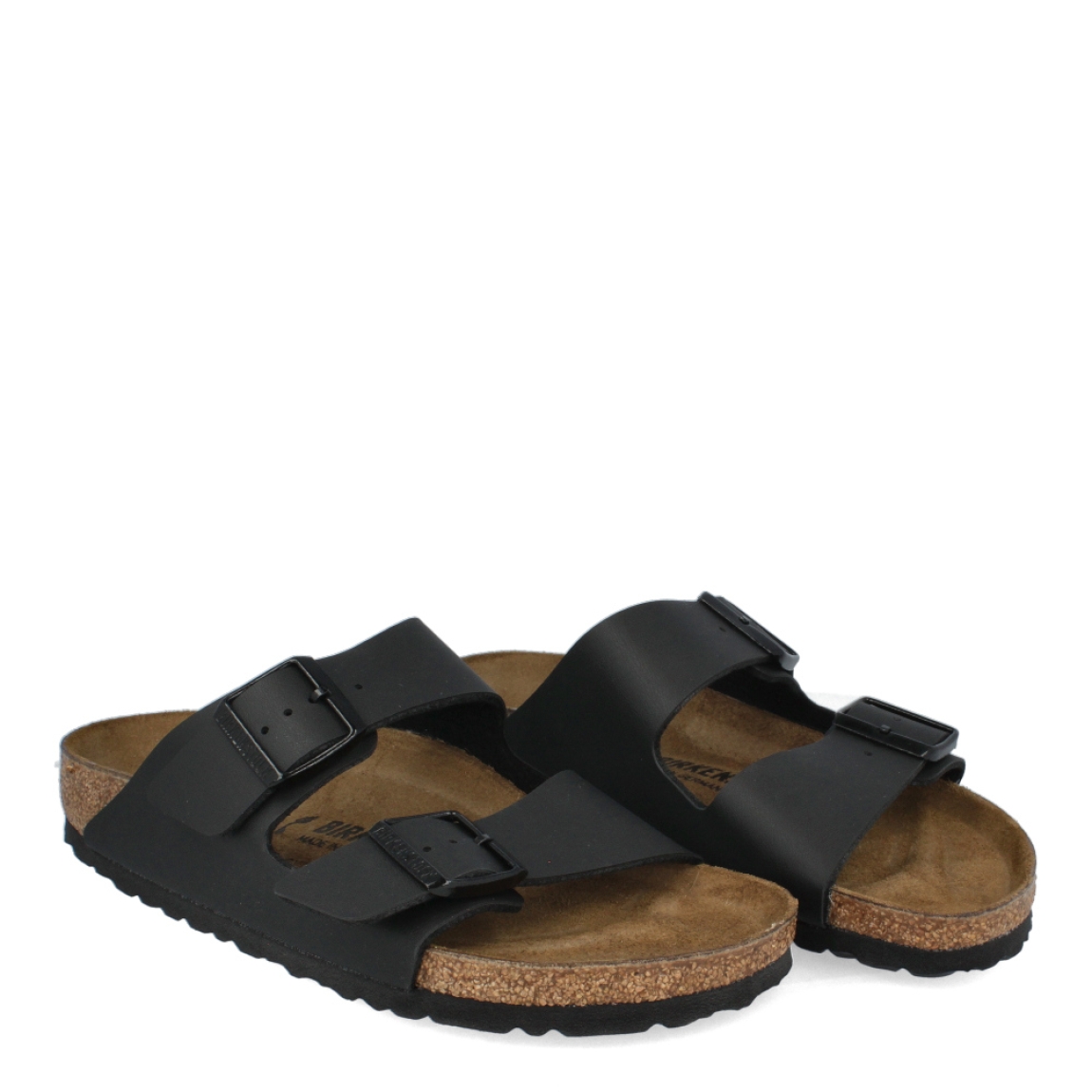 Sandalias de la marca Birkenstock, modelo ARIZONA BIRKO-FLOR. Sandalias elaboradas en neopreno de color negro con una base de corcho y látex de forma anatómica. Cierre de las sandalias con doble hebilla de espiga de metal con ajuste individual. Estas sandalias Birkenstock ARIZONA BIRKO-FLOR es un complemento clásico para tus looks de temporada, con un diseño sencillo atemporal y una ligereza que te dará la comodidad que necesitas en tu día a día.